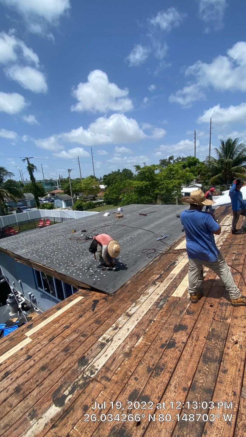 Standing Seam Metal & Flat Re-Roof using 1.5" Nail Strip 24ga Black Matte Kynar Coated Standing Seam Metal Panels by Morton Roofing, Inc.