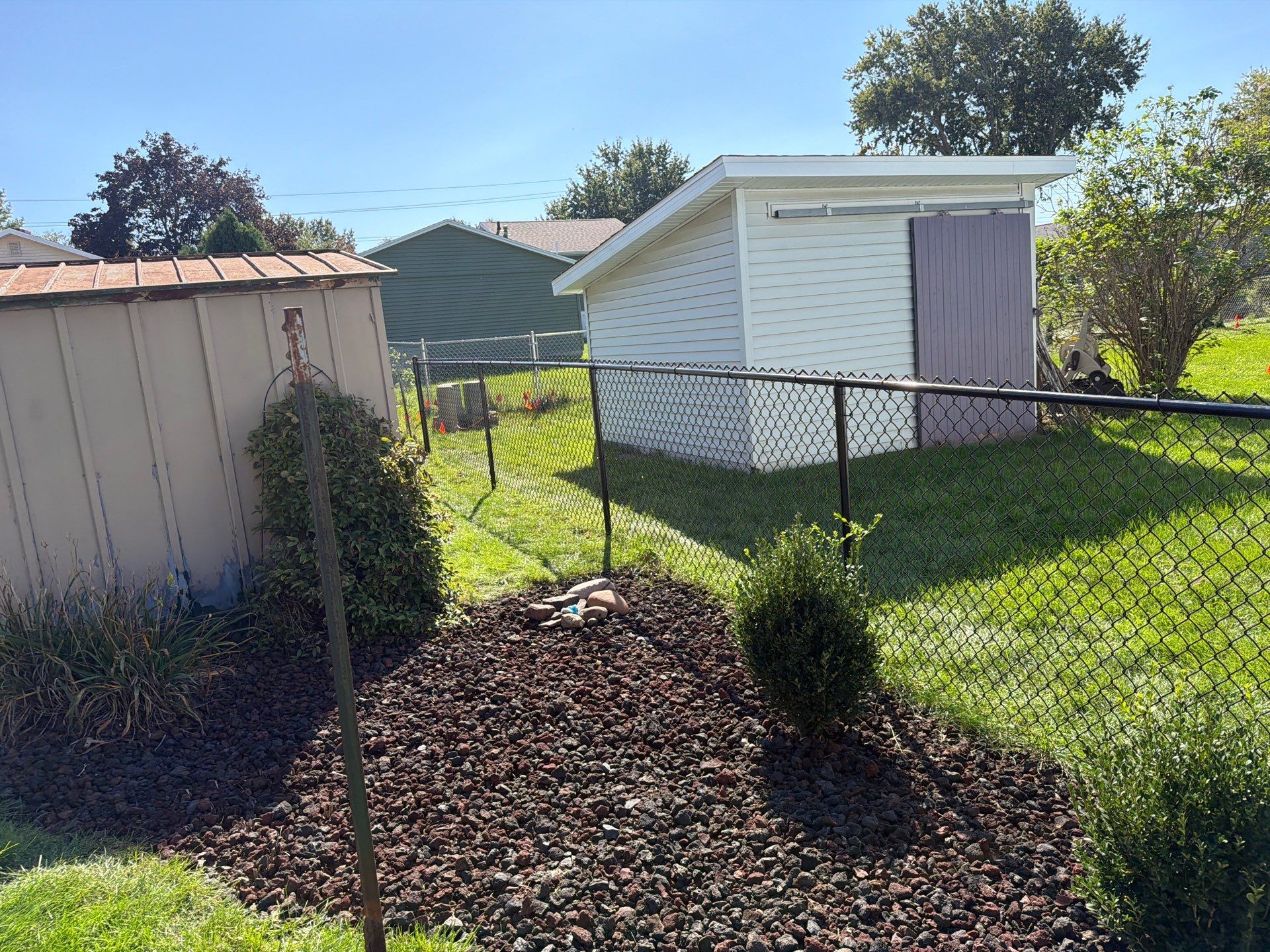 Custom Vinyl Privacy and Black Chain Link Fence Installation in Cedar Falls by Perfect Picket Fence and Stain