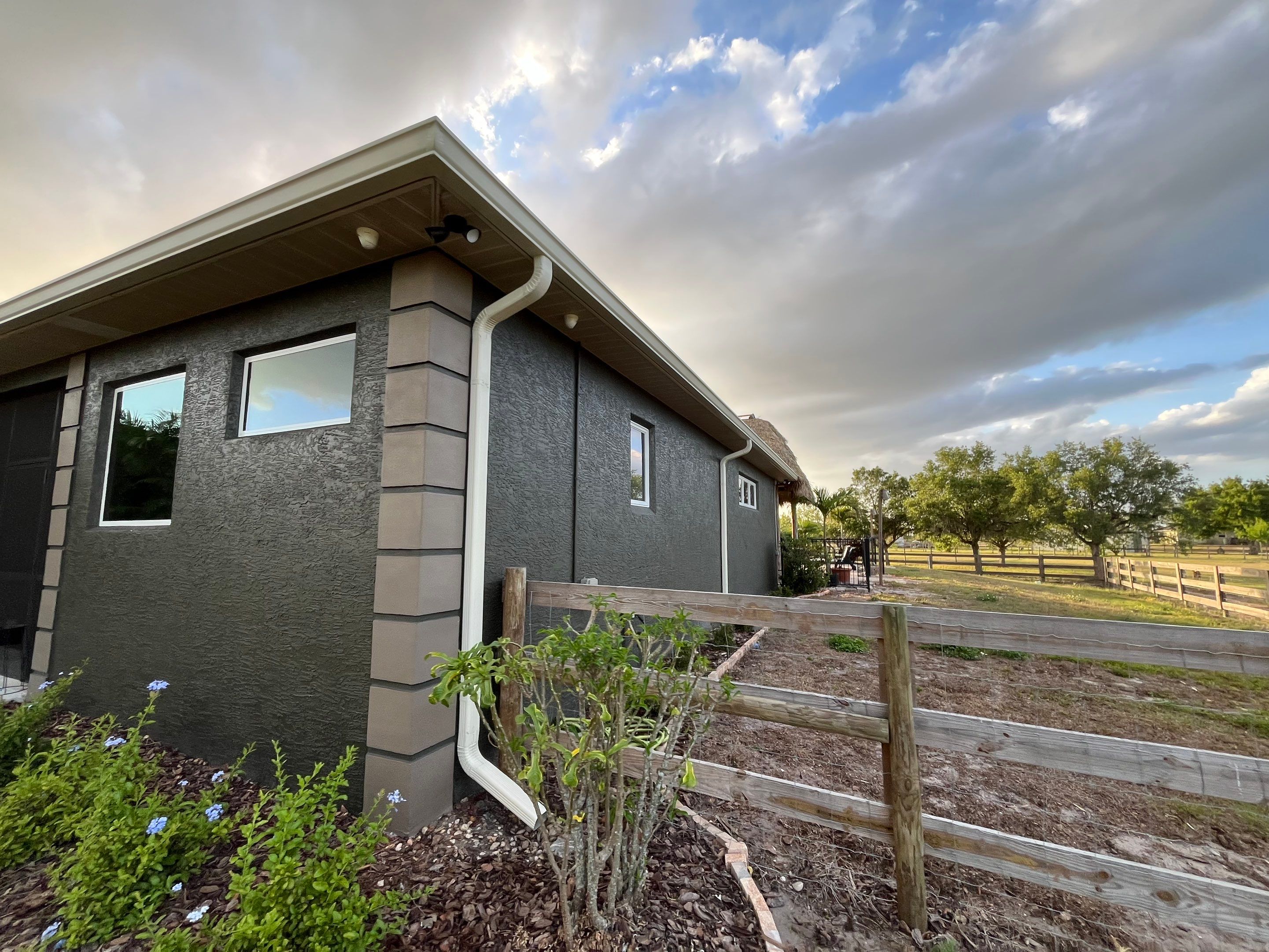  7-inch White seamless gutters and downspouts in Myakka City FL by Gutter Professors