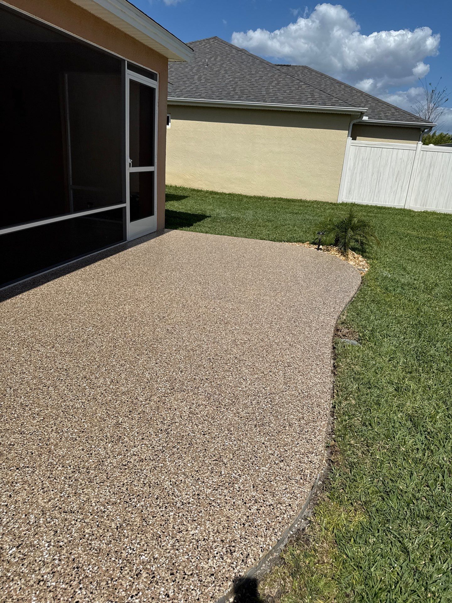 Garage and Lanai With Exterior Pad in Sandstone  by Innovative Concrete Coatings 