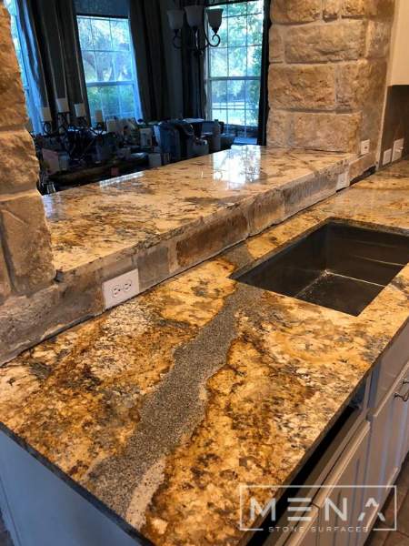 Kitchen countertops using Yellow River Granite  by Mena stone surfaces