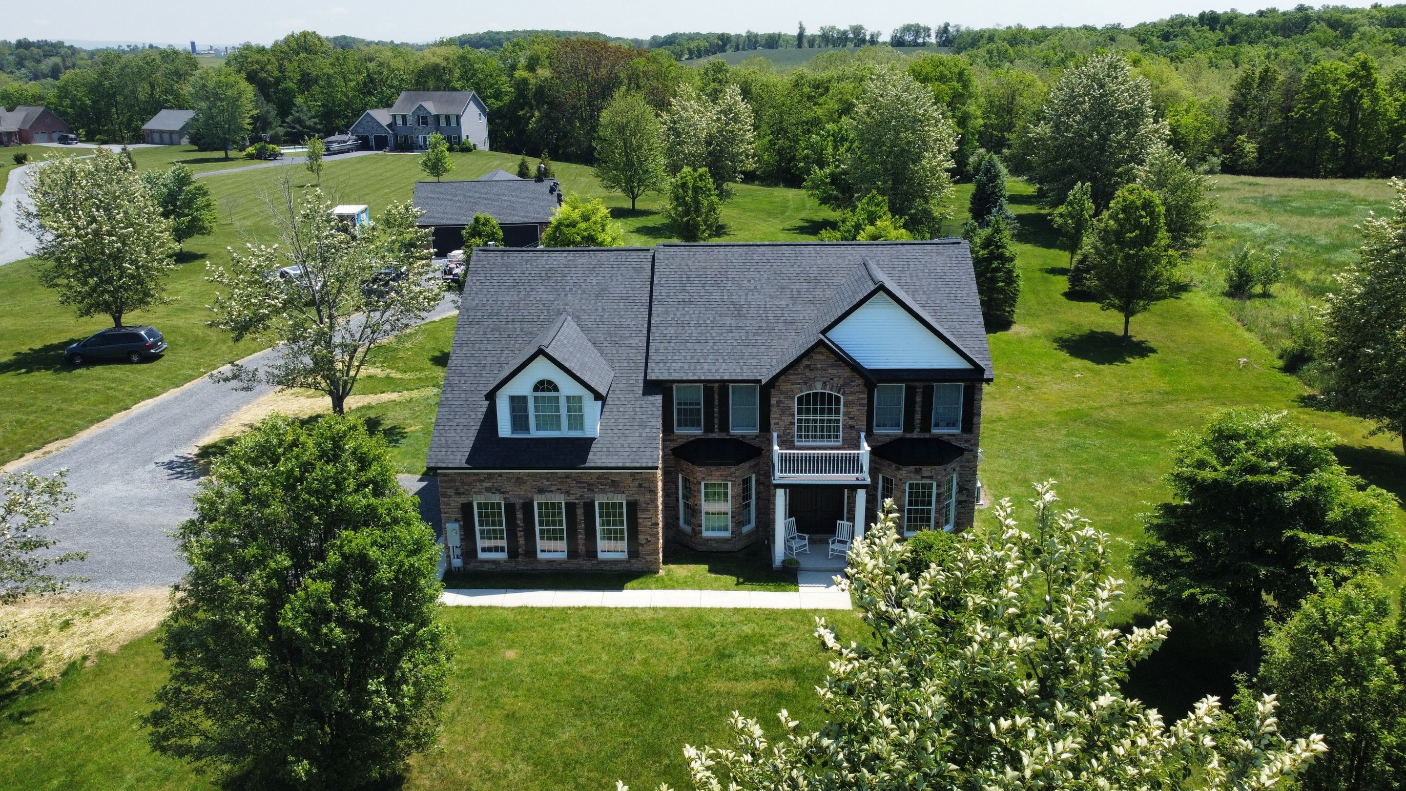 Roof Damage using Certainteed Lifetime Roofing System- Moire Black Landmark Pro shingkes with shadow ridge caps. by BulletpROOF Exteriors