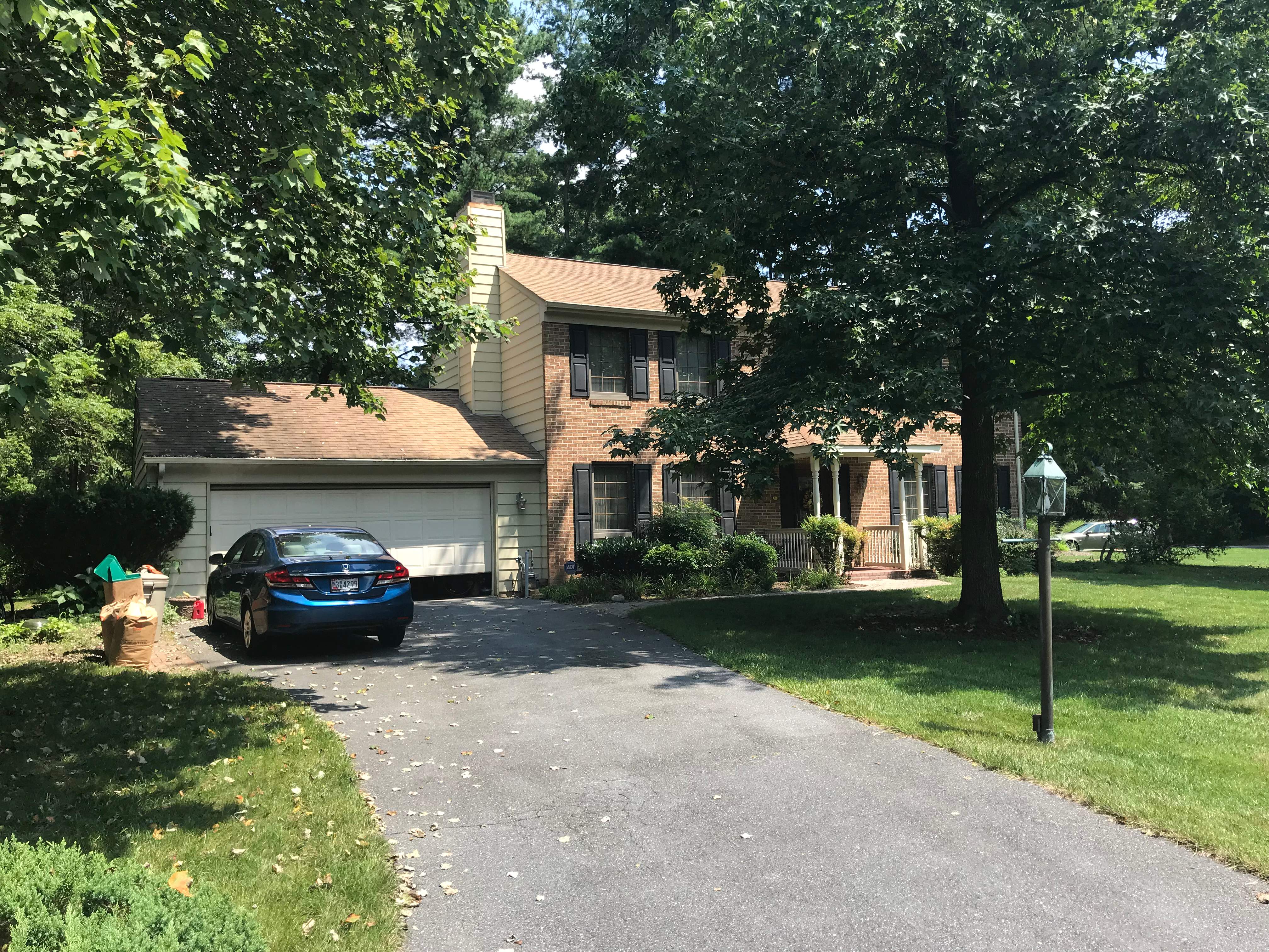 Residential Roofing Installation using Landmark Shingles Color Weatherwood by Alpha Design Services