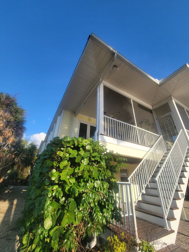 White Gutters with Matching Downspouts in Sarasota FL by Gutter Professors