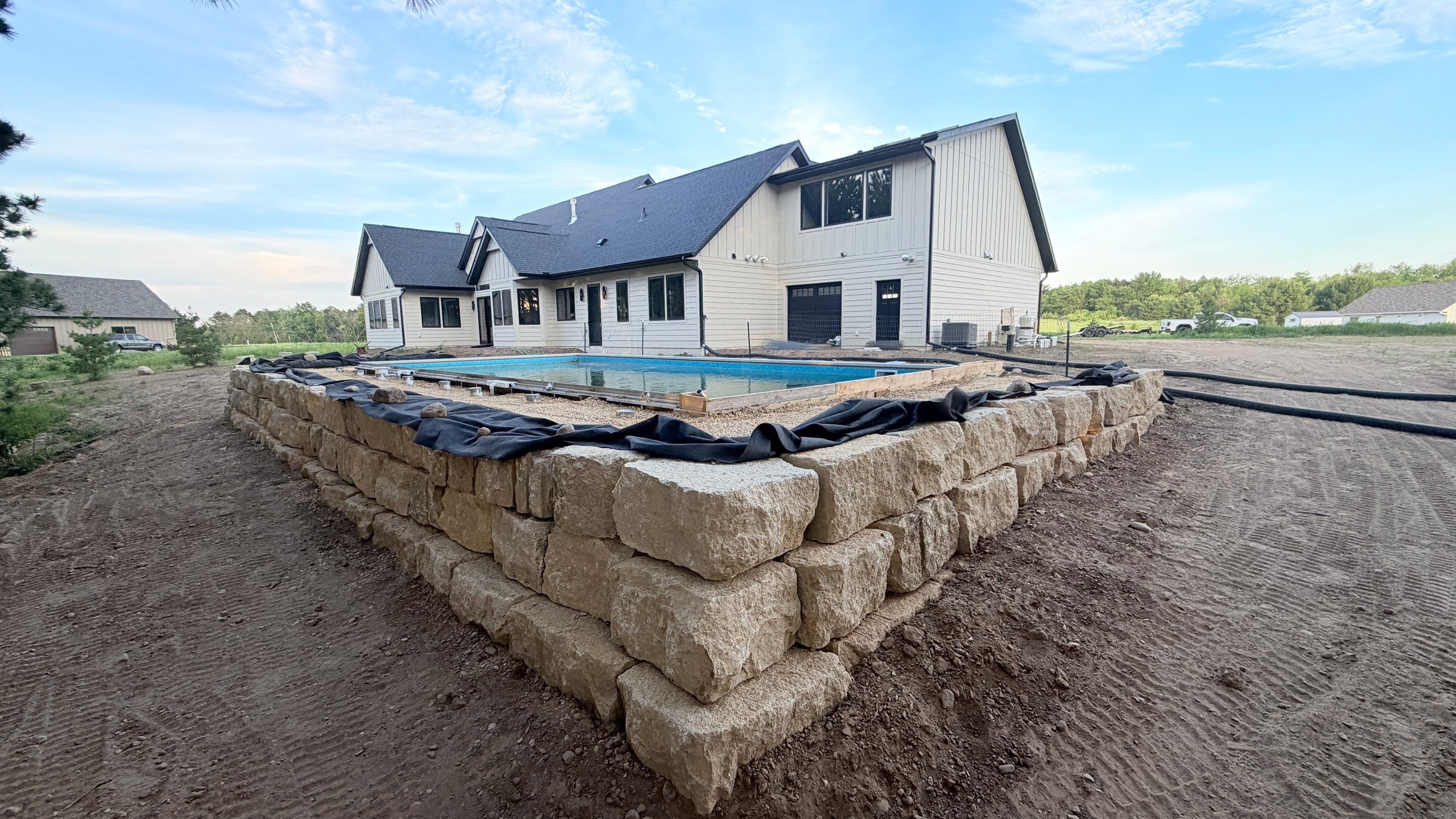 Limestone Boulder Wall by Sota landscaping