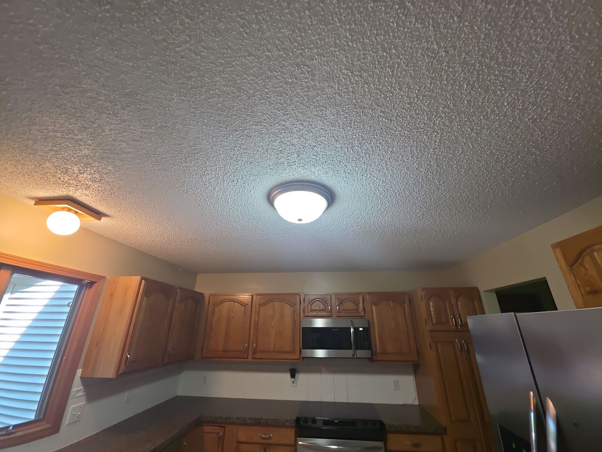 Norton Shores Kitchen Cabinet Painting and Deck Restoration Project by Gordon Painting