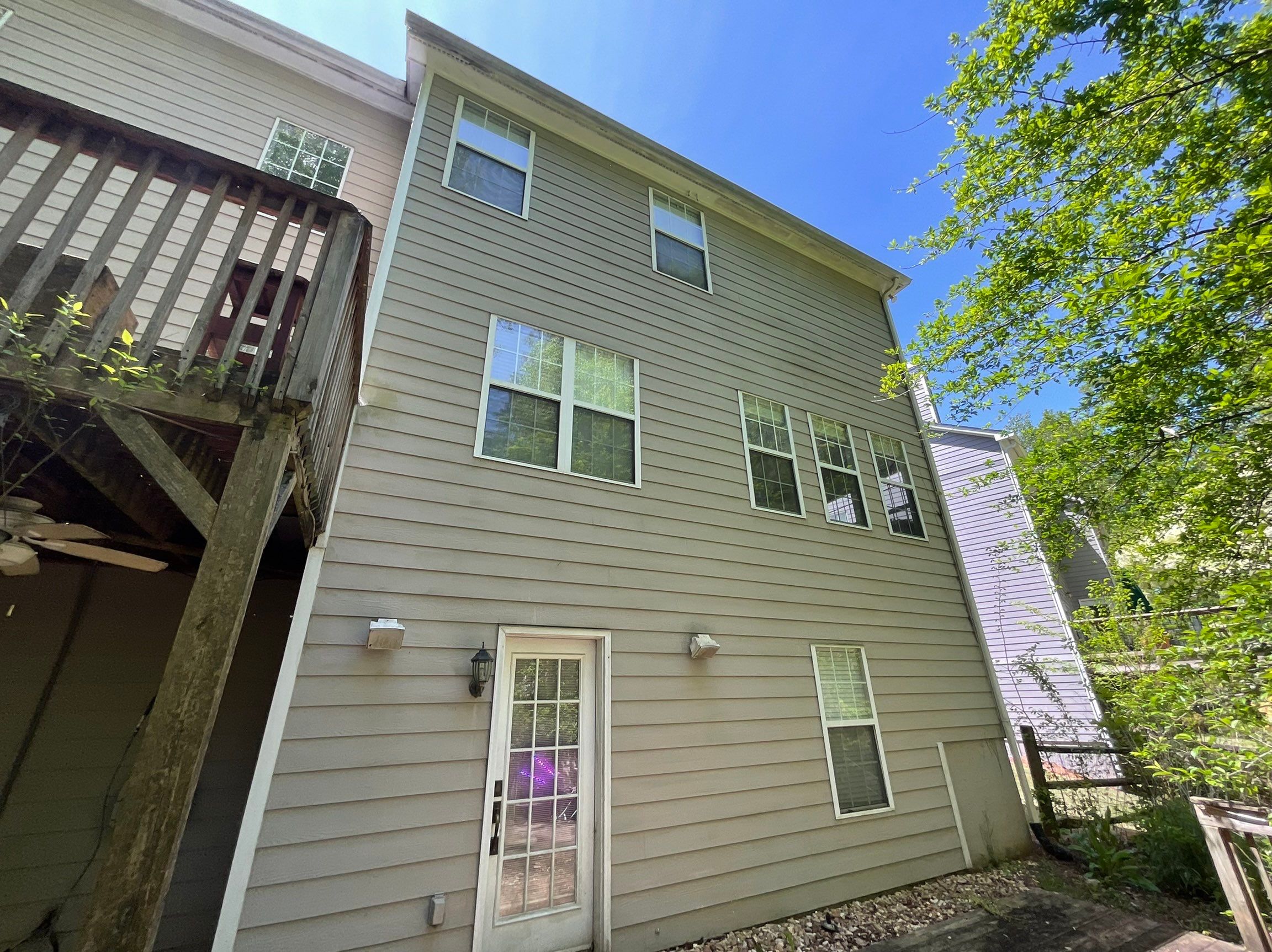 Stucco and Siding Exterior Painting with New Gutters in Kennesaw by Swift Home Renovations