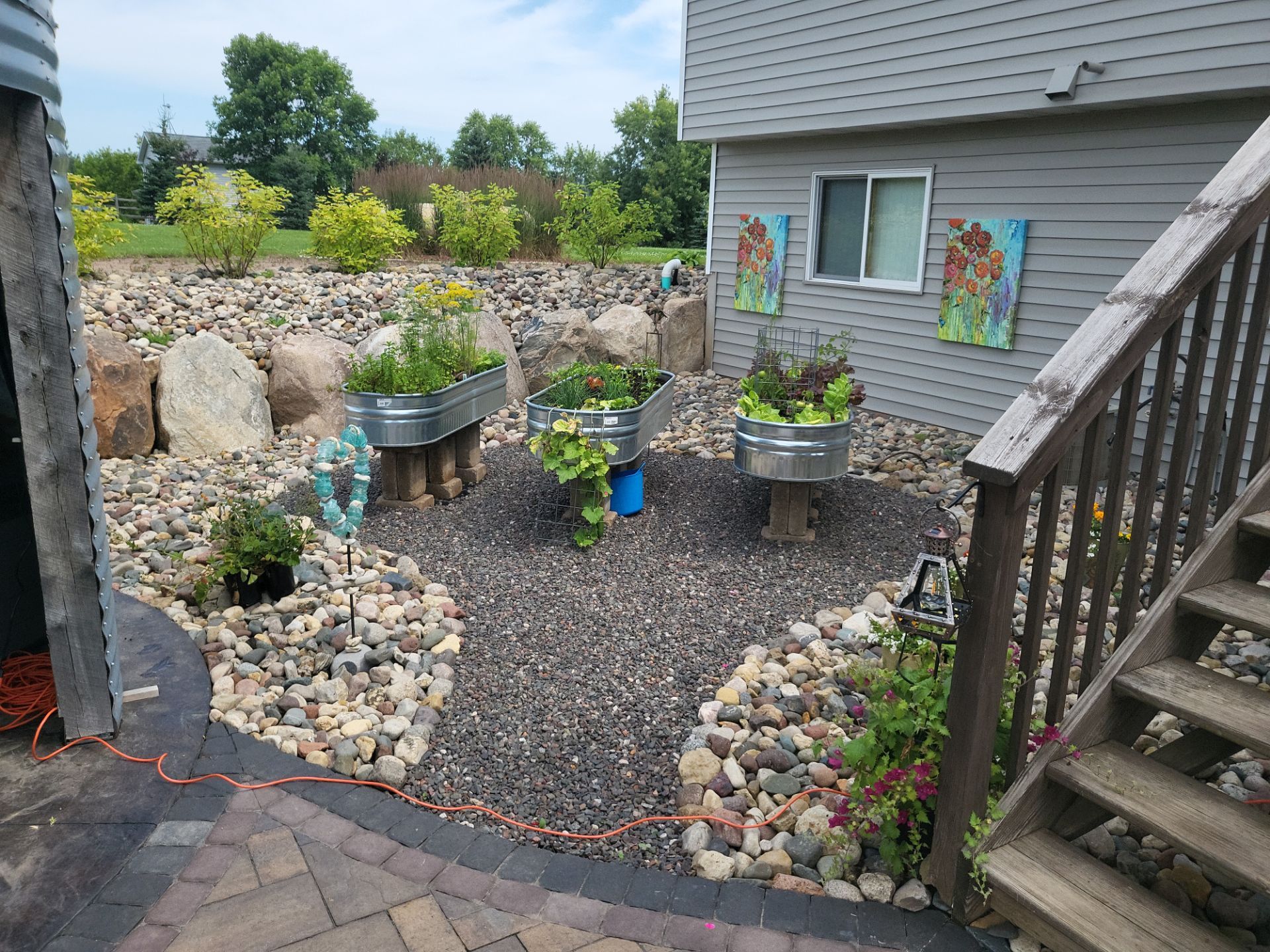Paver Patio/ Outdoor Living Area/ Raised Garden Beds/ Water Feature by Balsam Lake Pro Lawn