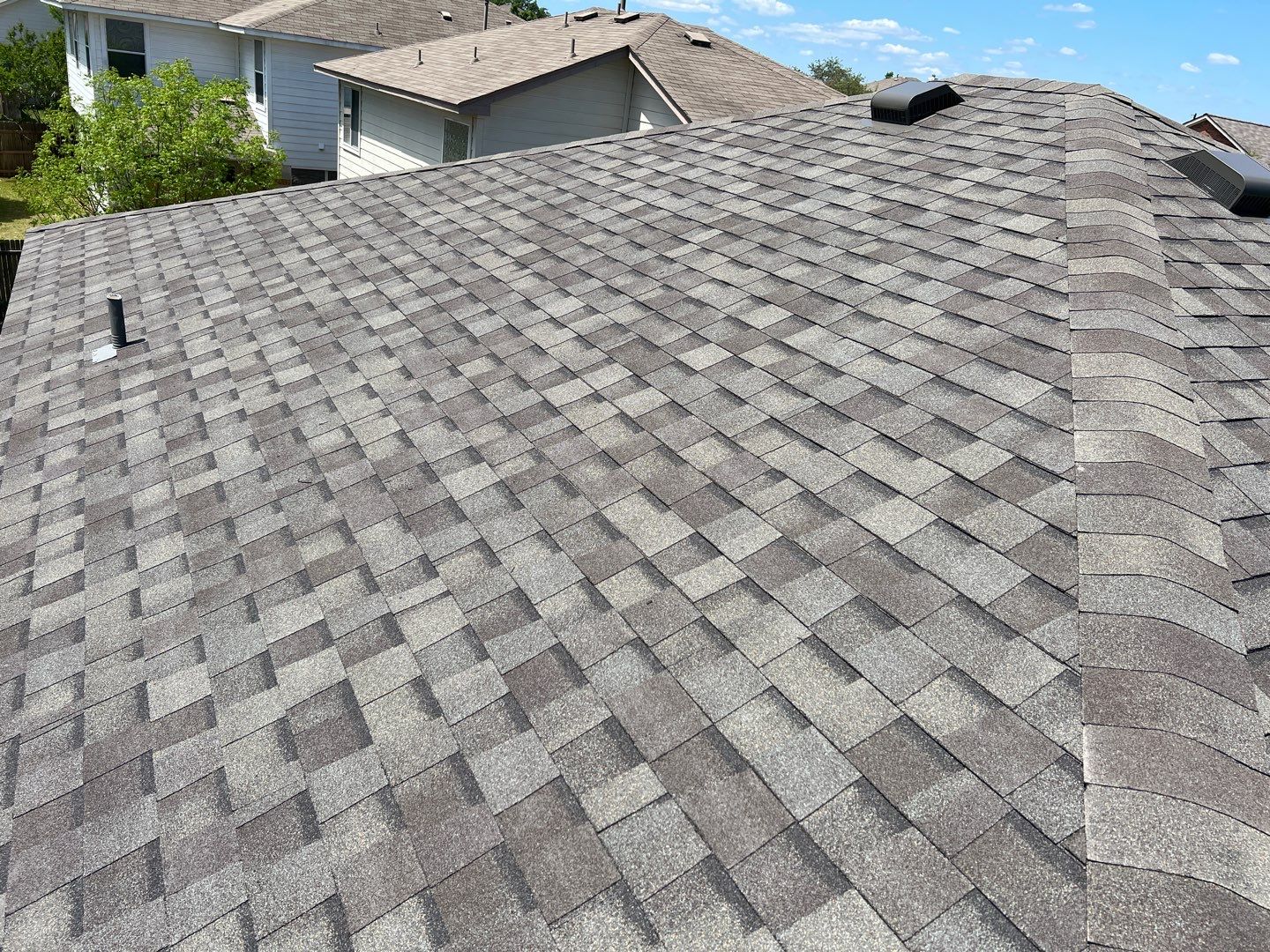 Wind damaged roof replacement by Oakwood Roofing and Construction, LLC