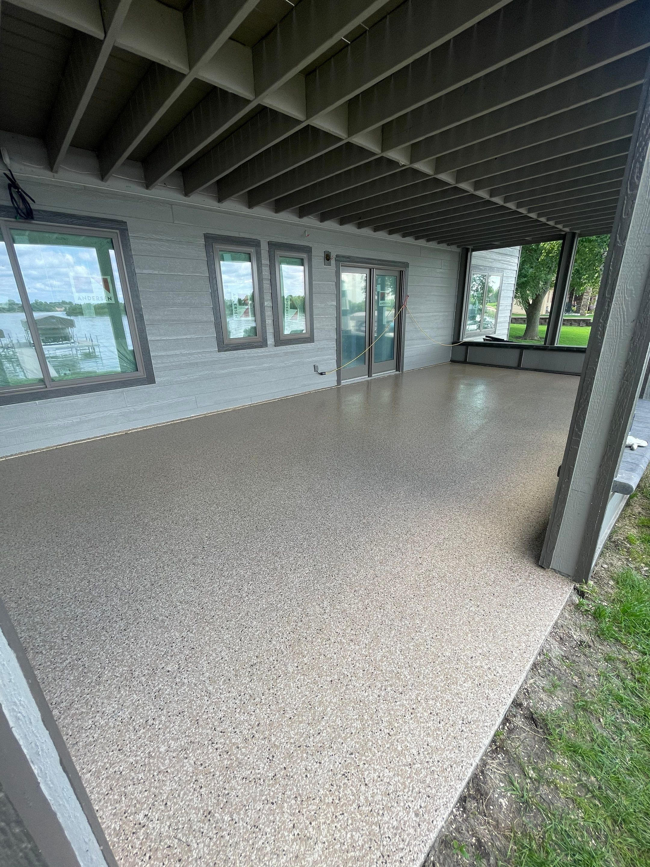 Lakefront Screened Patio Concrete Coating Installation in Wentworth by Select Painting, Coatings & Garage Cabinets