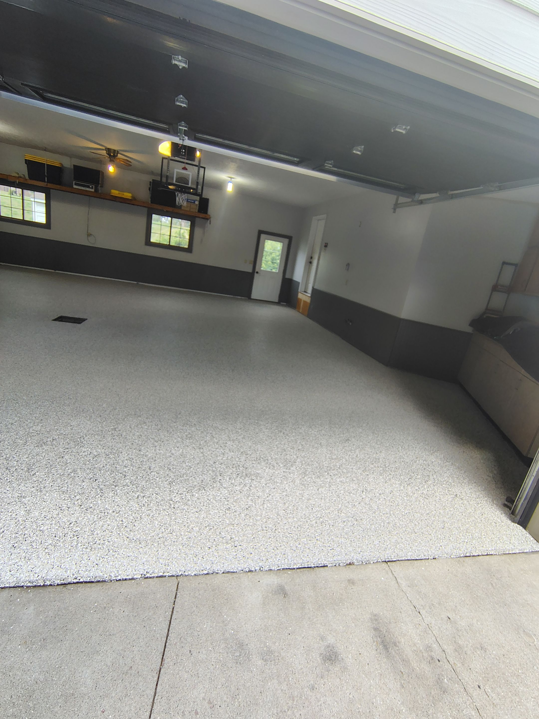 Multi-Fleck Epoxy Garage Floor Coating in Dell Rapids by Select Painting, Coatings & Garage Cabinets