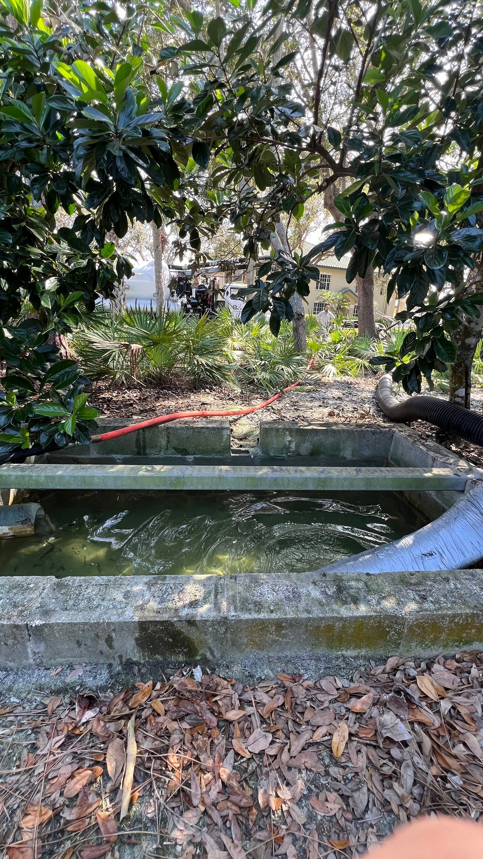 Pelican Landing Tennis Court Catch Basin Cleaning by APS Power & Water