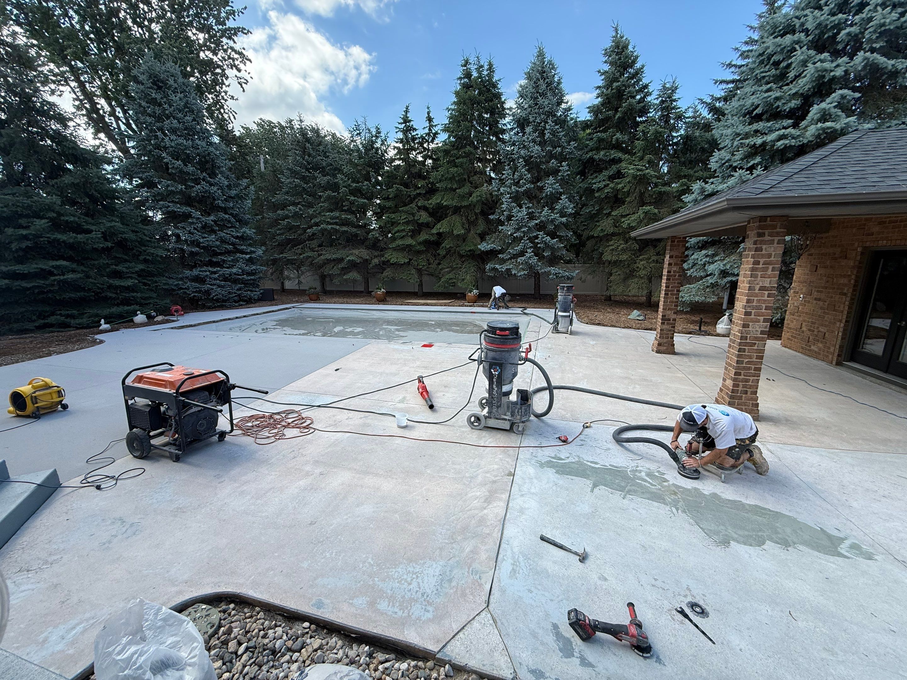 Decorative Concrete Pool Deck and Patio Resurfacing in Sioux Falls by Select Painting, Coatings & Garage Cabinets
