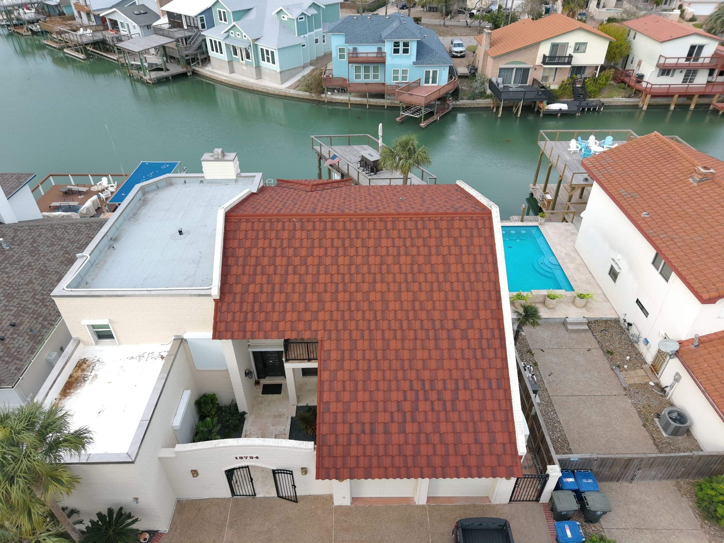 Off with the Tile and on with the TILCOR stone coated metal.  by Bayfront Roofing and Construction