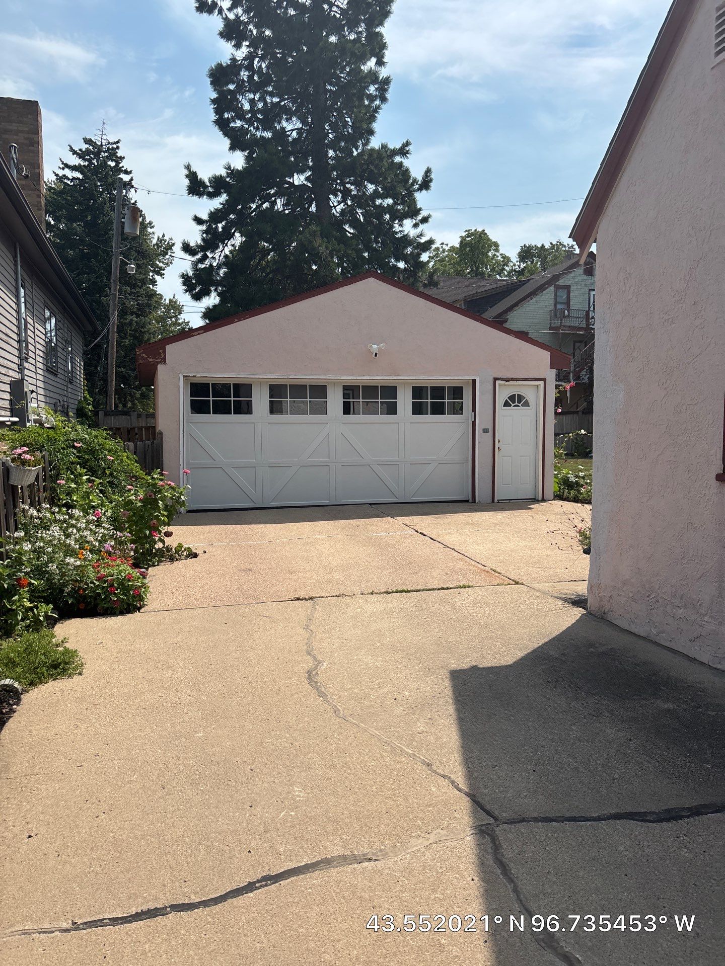 Exterior Stucco Painting and Trim Refresh in Sioux Falls by Select Painting, Coatings & Garage Cabinets