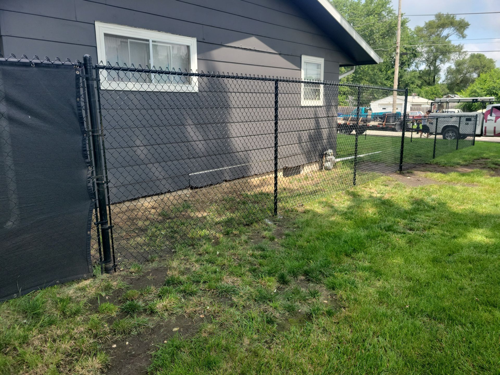 Black Chain Link Perimeter Fence Installation in Waterloo by Perfect Picket Fence and Stain