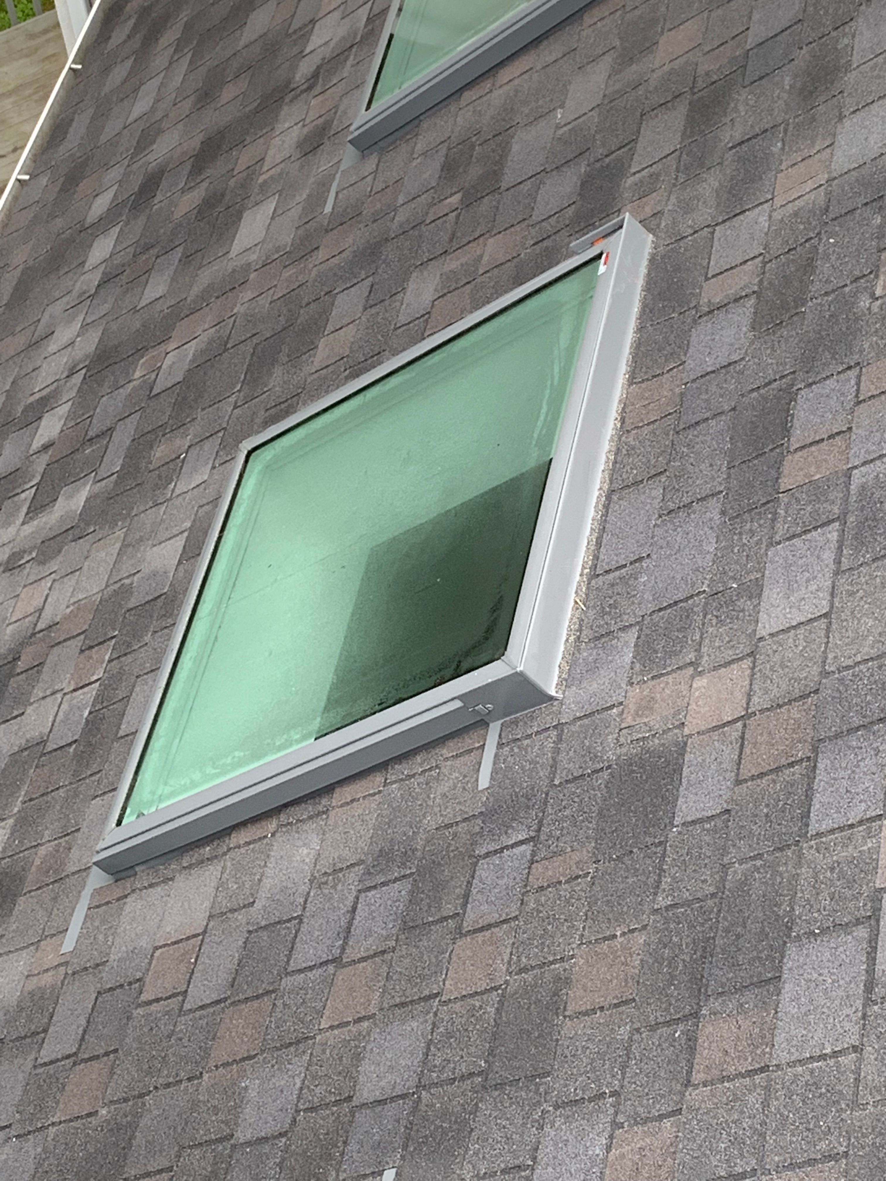 Skylight, Roof, and Gutter Replacement by American Home Contractors
