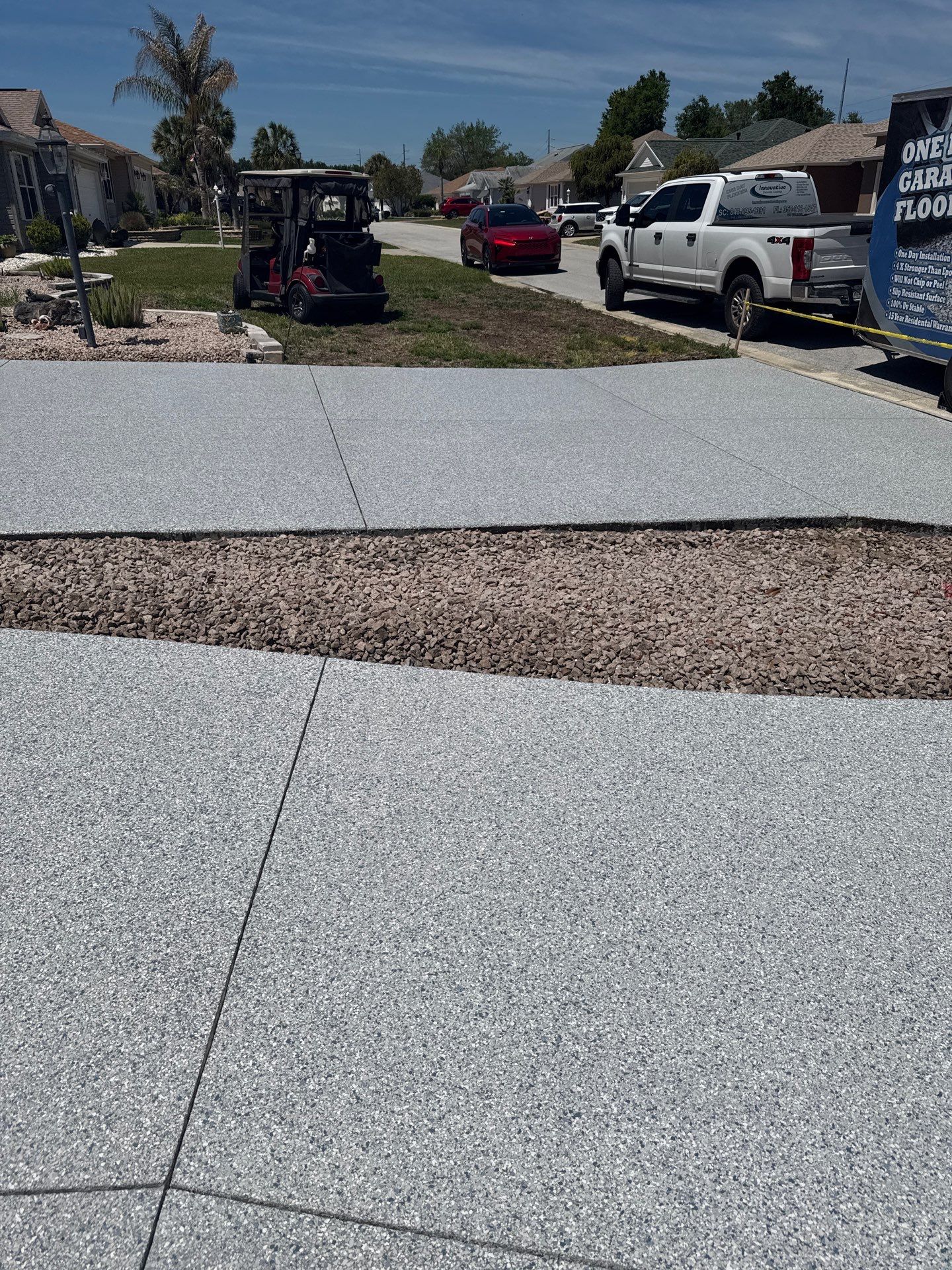 Garage, Drivewat, and Sidewalk in Landshark and Tidalwave by Innovative Concrete Coatings 