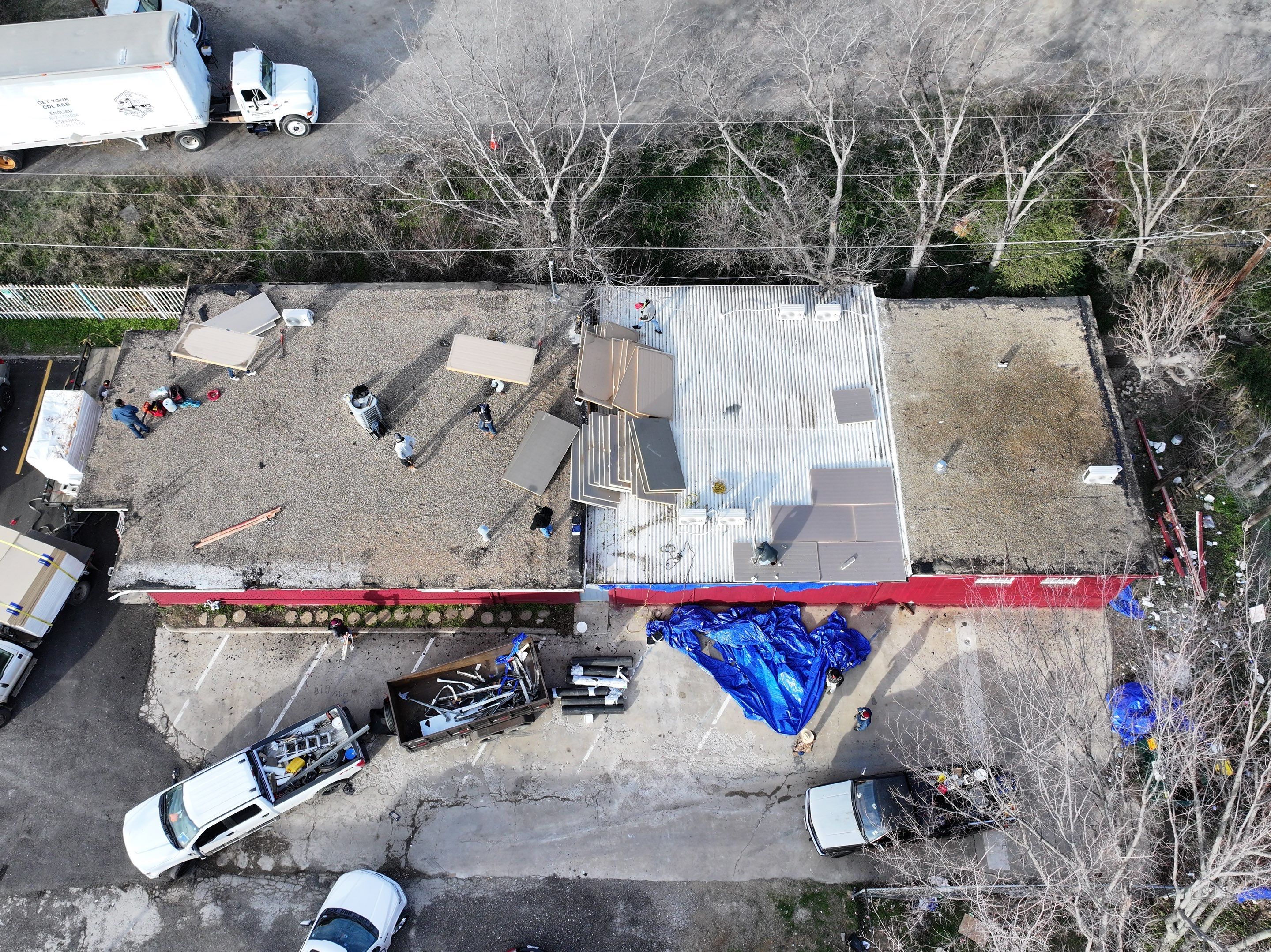 Commercial roofing overlay using GAF TPO over an old ballast roof by Becker Roofing and Exteriors