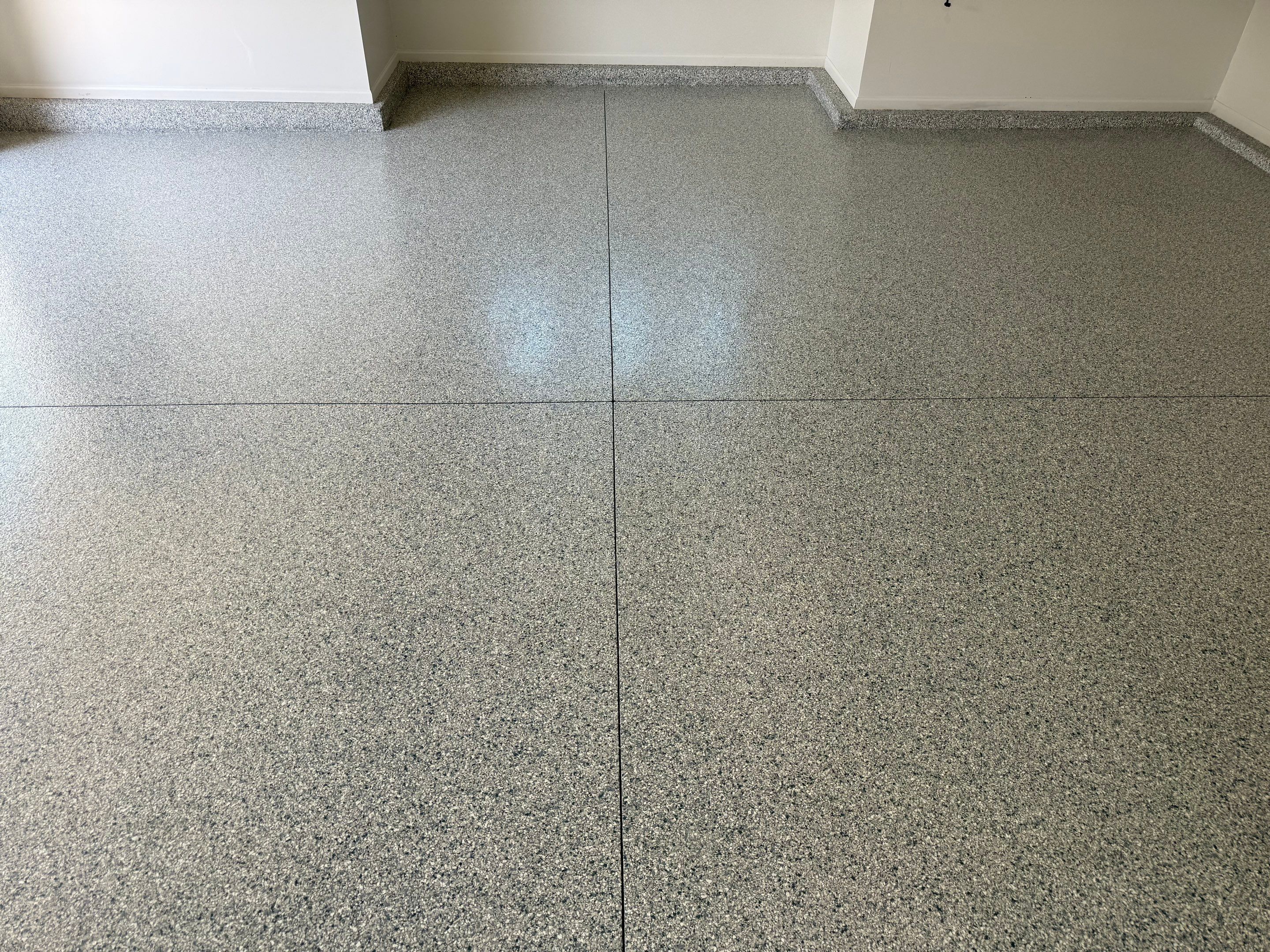 Decorative Chip Epoxy Floor Coating Installation in Sioux Falls by Select Painting, Coatings & Garage Cabinets