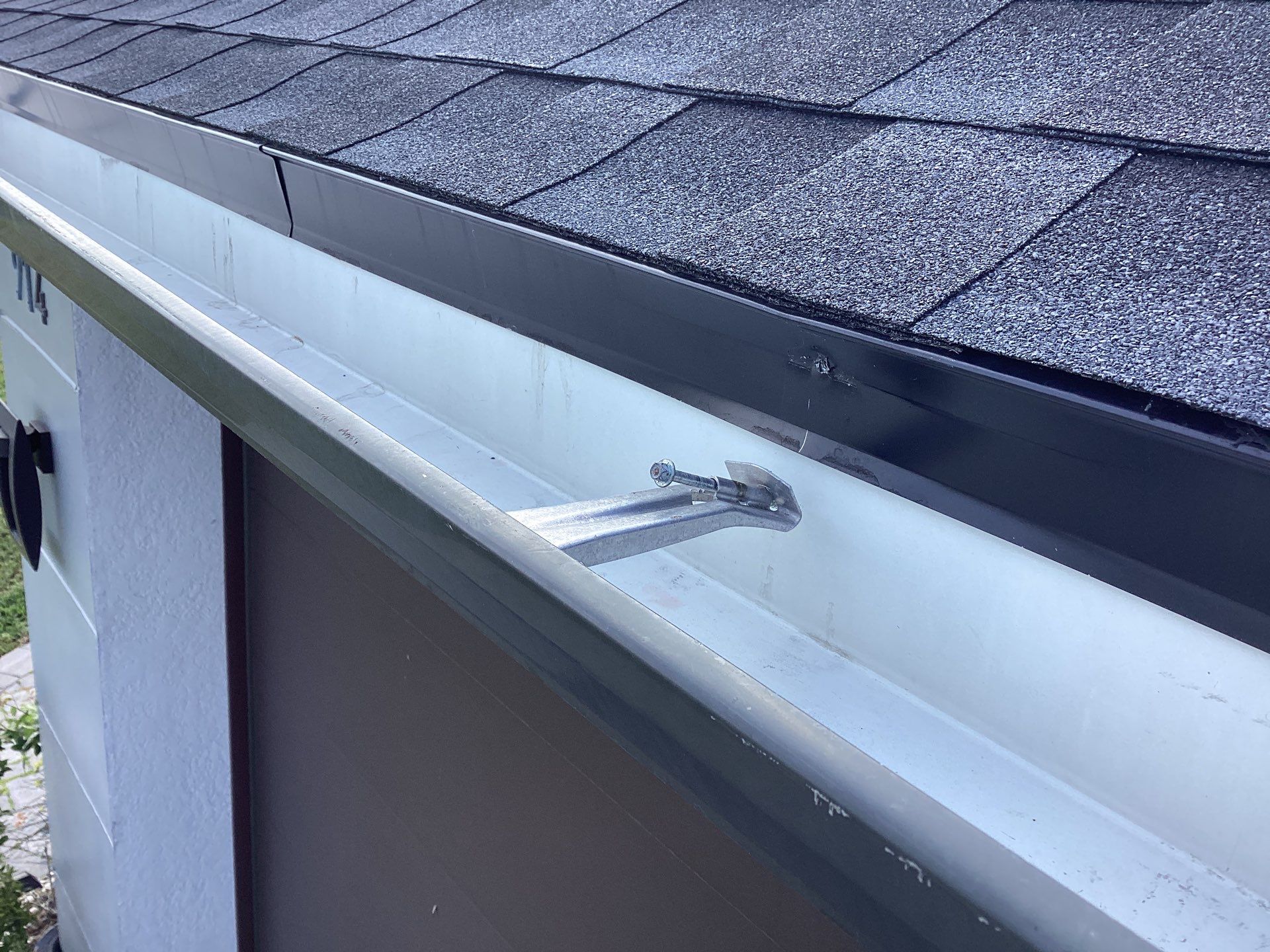Black Seamless Gutters using 6 Inch Seamless Gutters in Cape Coral FL by Gutter Professors