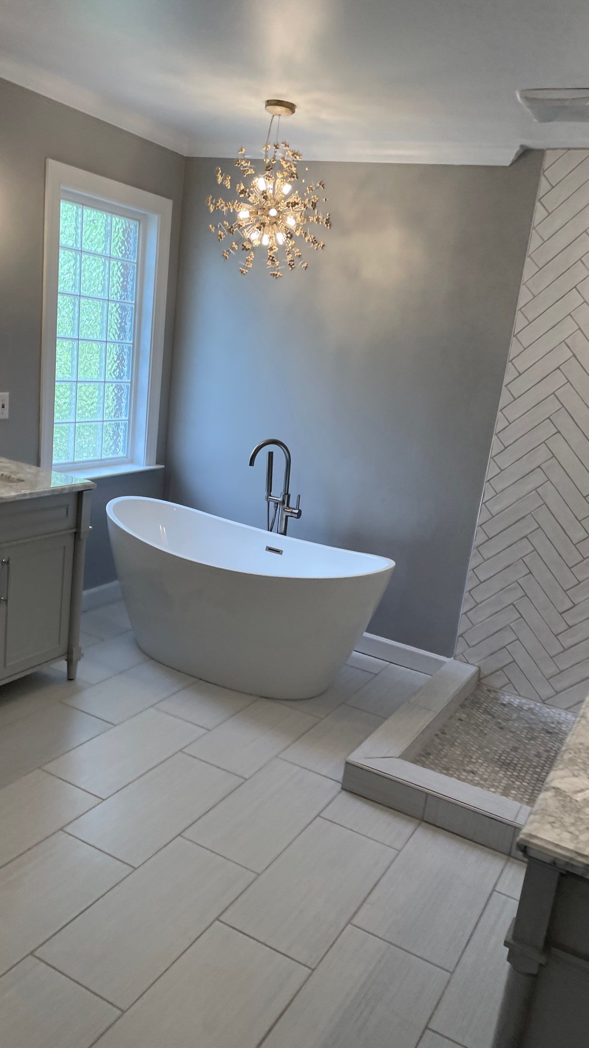Bathroom Remodel using Schluter by Footprints Floors of Coastal Carolina