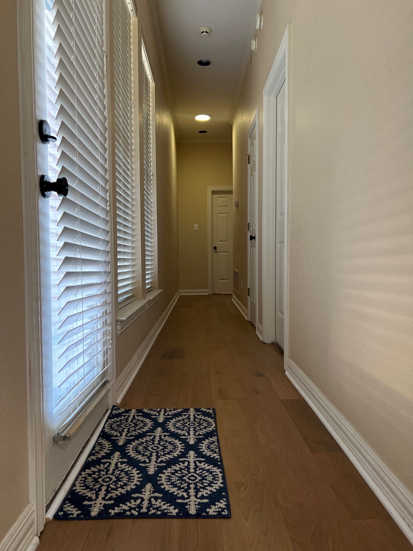Wide-Plank Wood Flooring Replacement and Custom Herringbone Entryway by Simmons Floors 