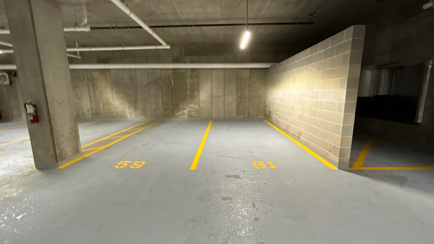 Parking garage using Hot water by Northern Power Washing LLC.