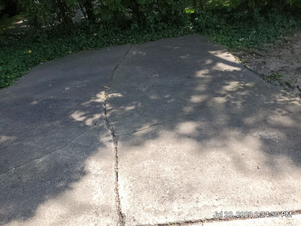 Aggregate concrete cleaning and sealing using Surebond SB-9000 by Northern Power Washing LLC.