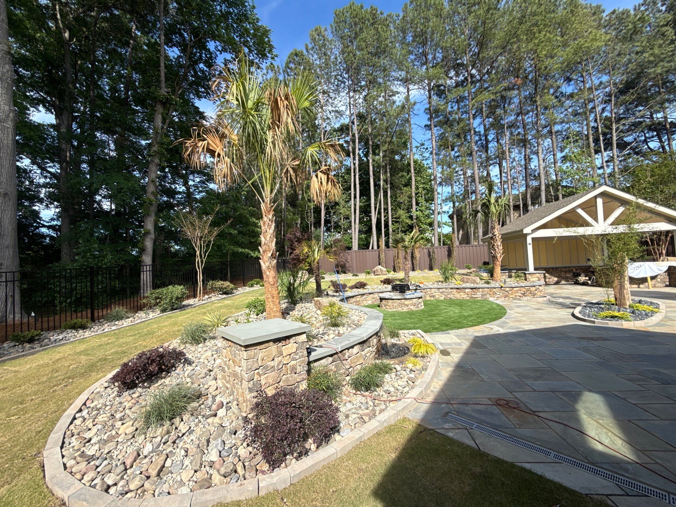 Backyard oasis in Cary by Martinez Brother’s Nc Landscaping Inc
