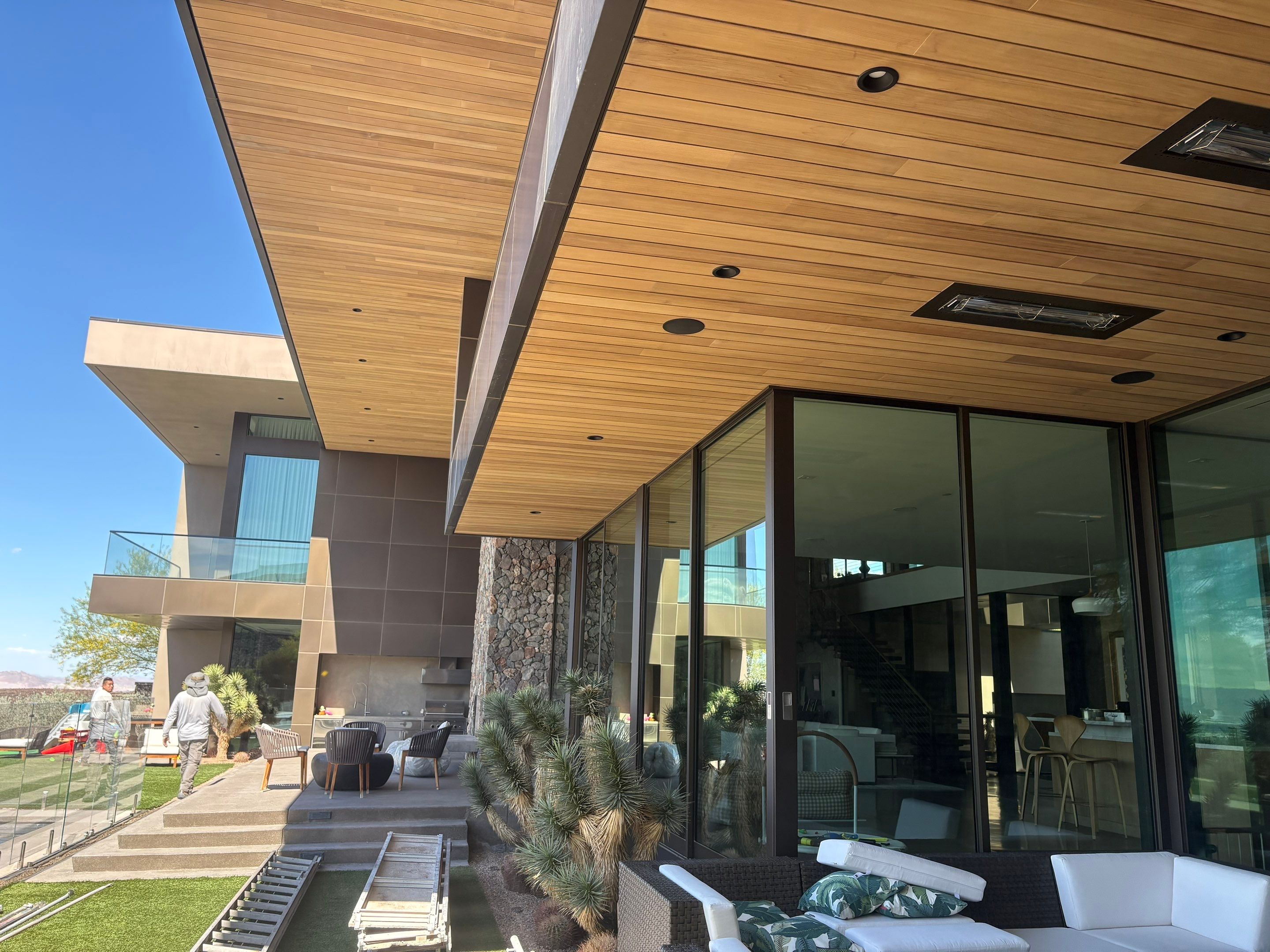 Exterior wood refinish & glass pool enclosure by Level Builders
