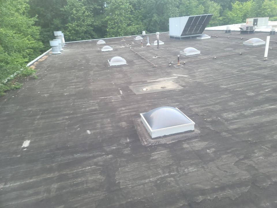 Commercial Roofing Repair using UniFlex Silicone Roof Coating by 3 Daughters Construction 