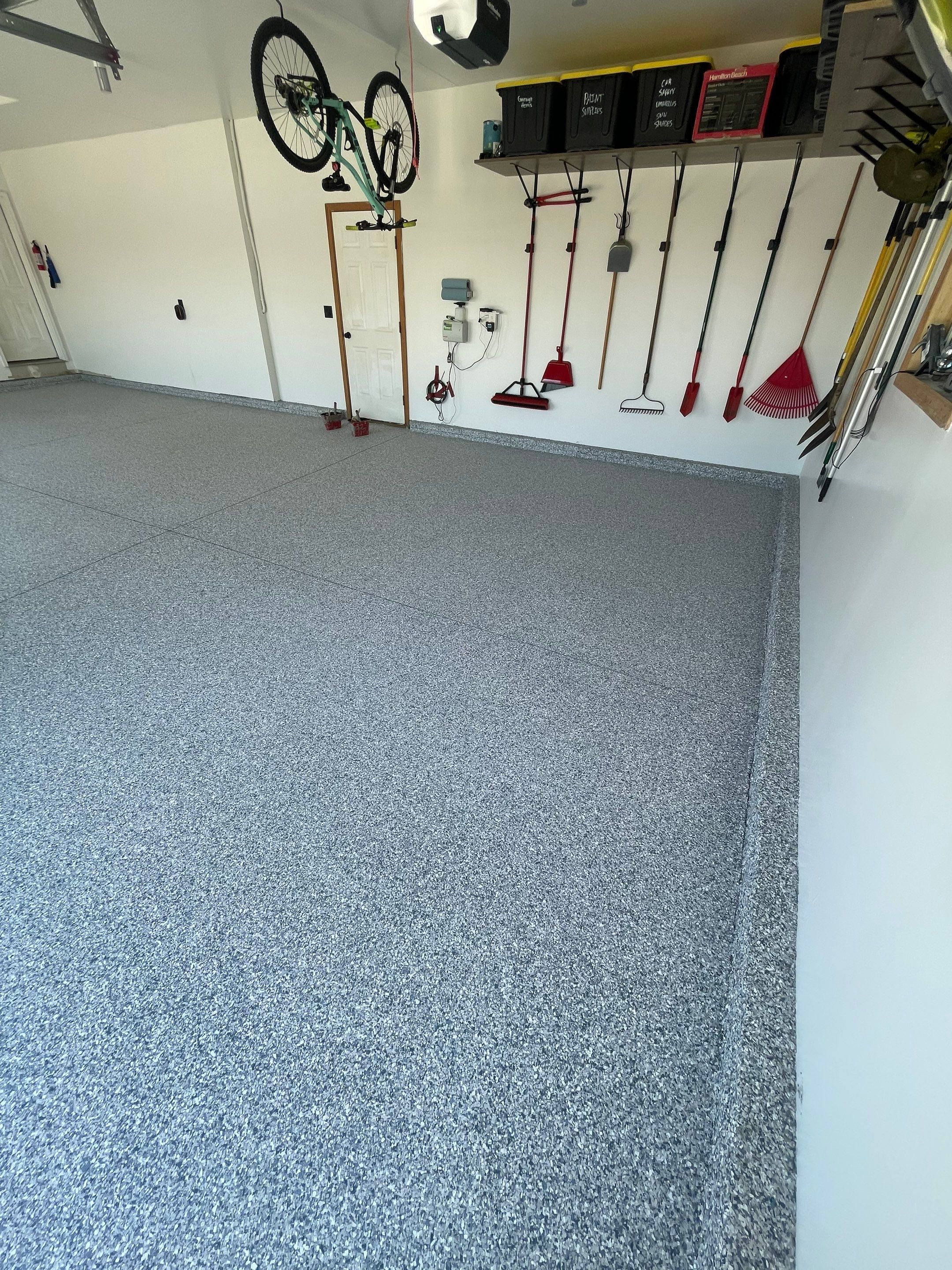 Tidal Wave Flake Garage Floor Installation in Sioux Falls by Select Painting, Coatings & Garage Cabinets