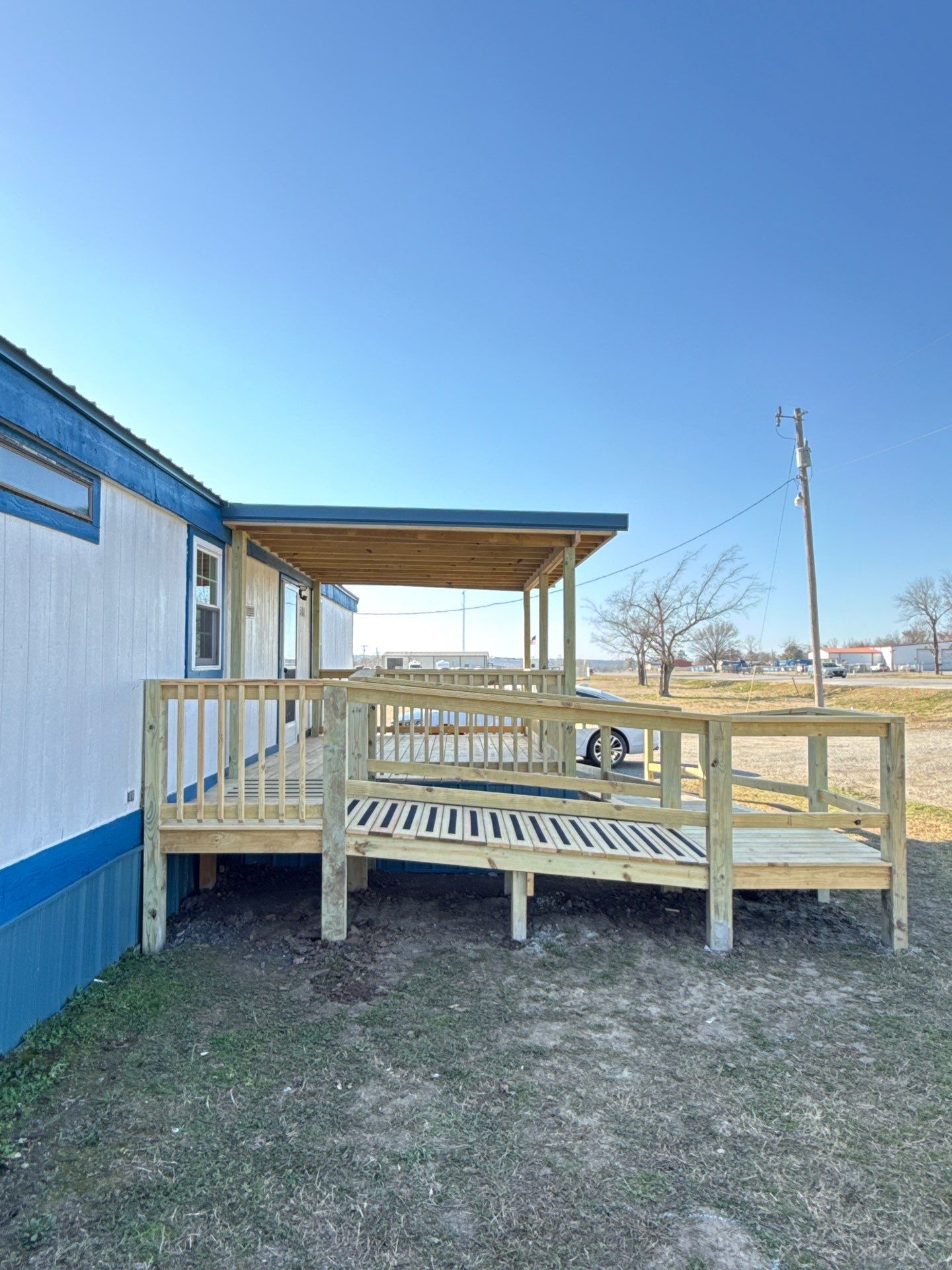 Covered Deck w/ ADA Ramp by In & Out Construction & Remodeling, LLC