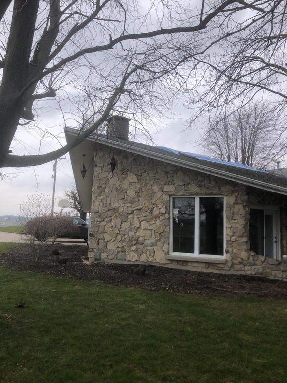 Storm damage roof replacement by Nitro Roofing and Construction