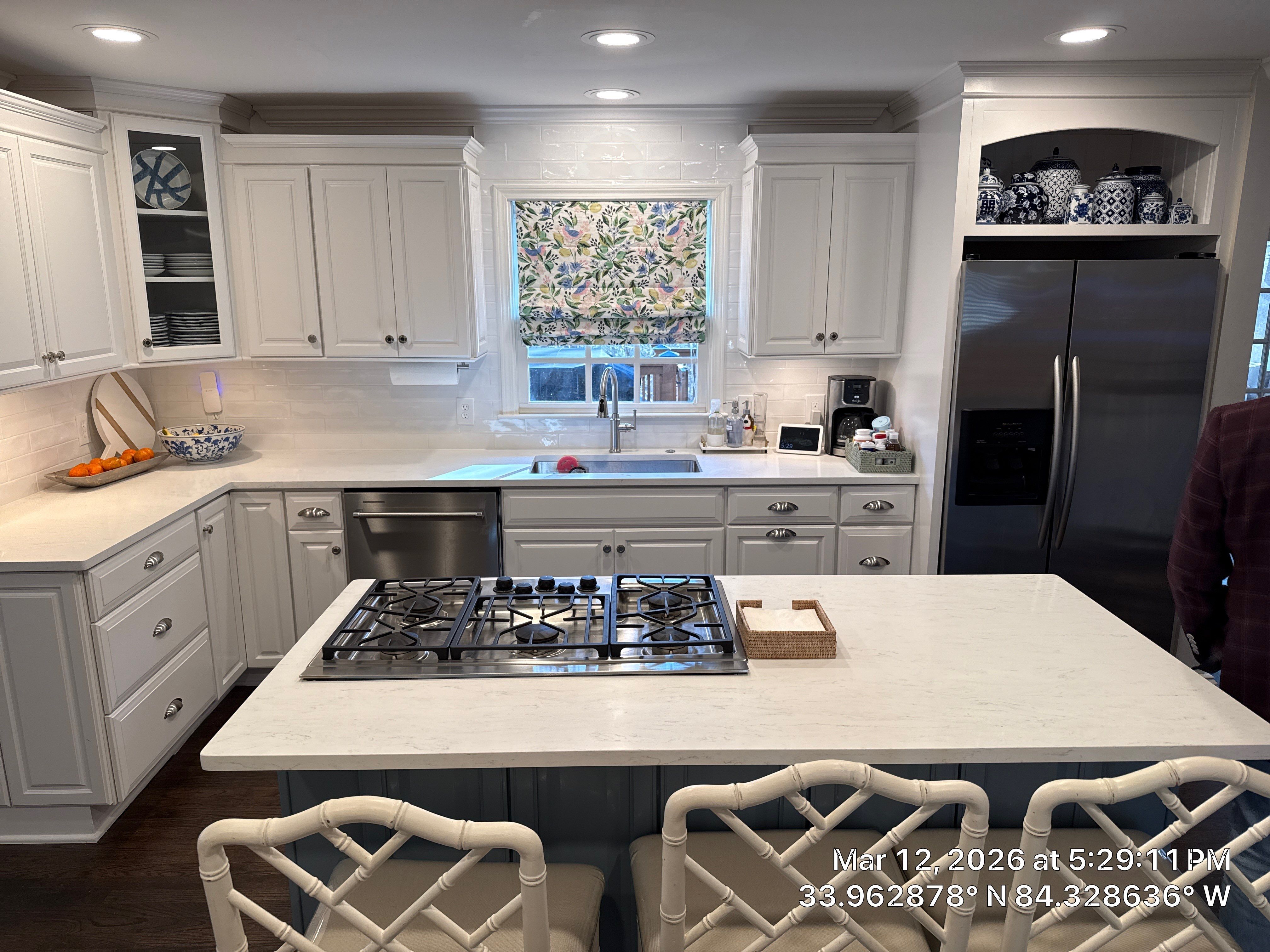Kitchen Remodel in Dunwoody Featuring White Cabinetry and Blue Island