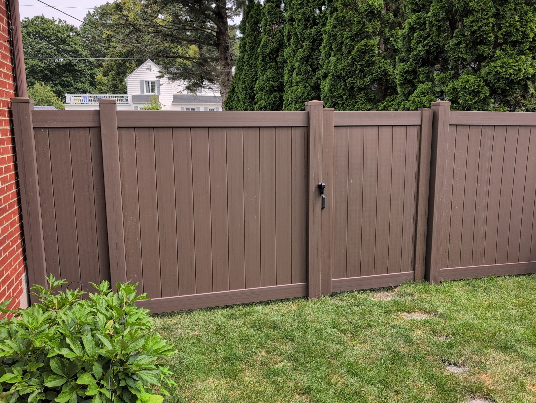 Walnut Vinyl Privacy Fence Installation in Waterloo by Perfect Picket Fence and Stain
