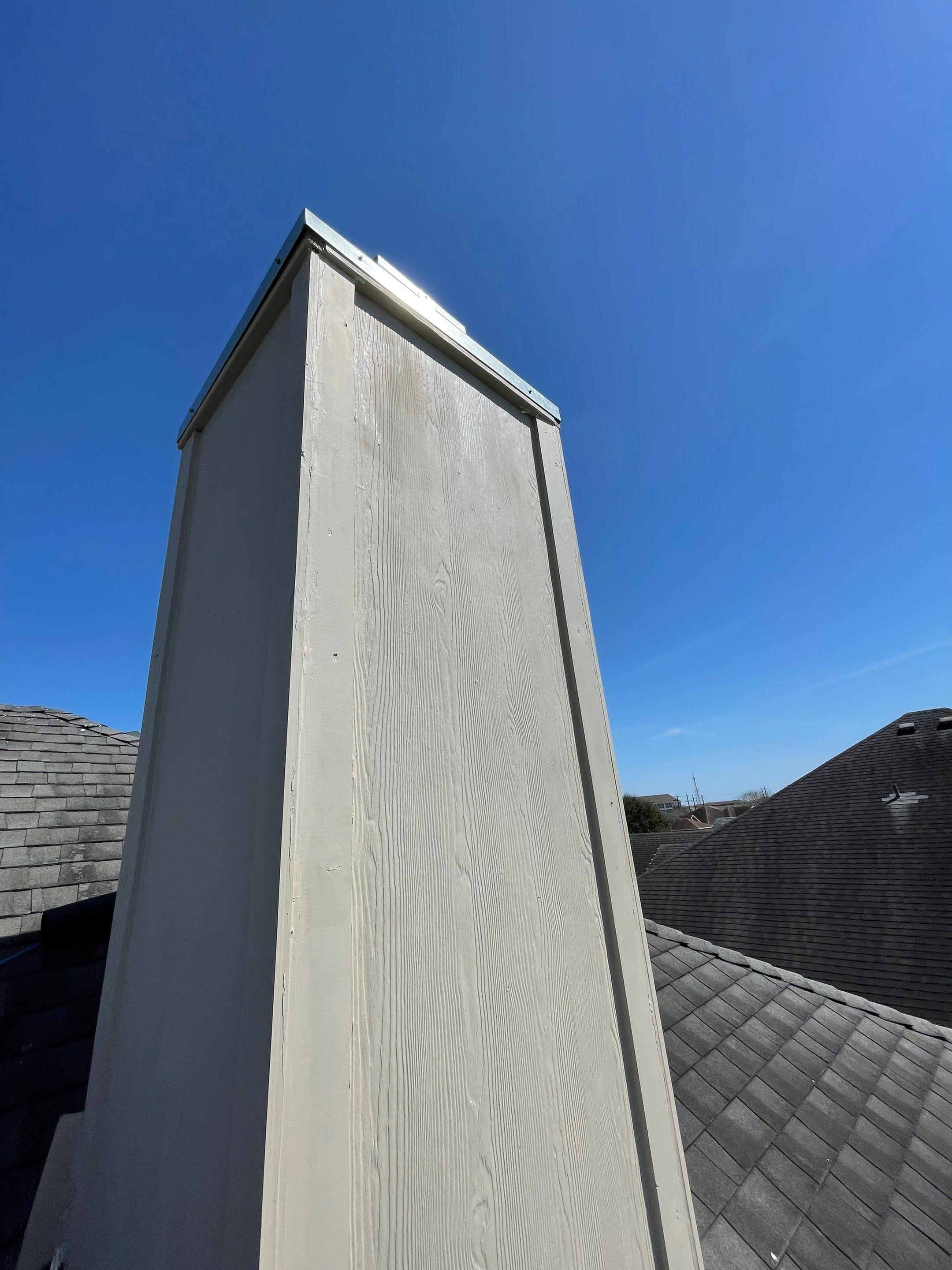 Residential Roofing Repair Replacing Chimney Cap by Lighthouse Roofing
