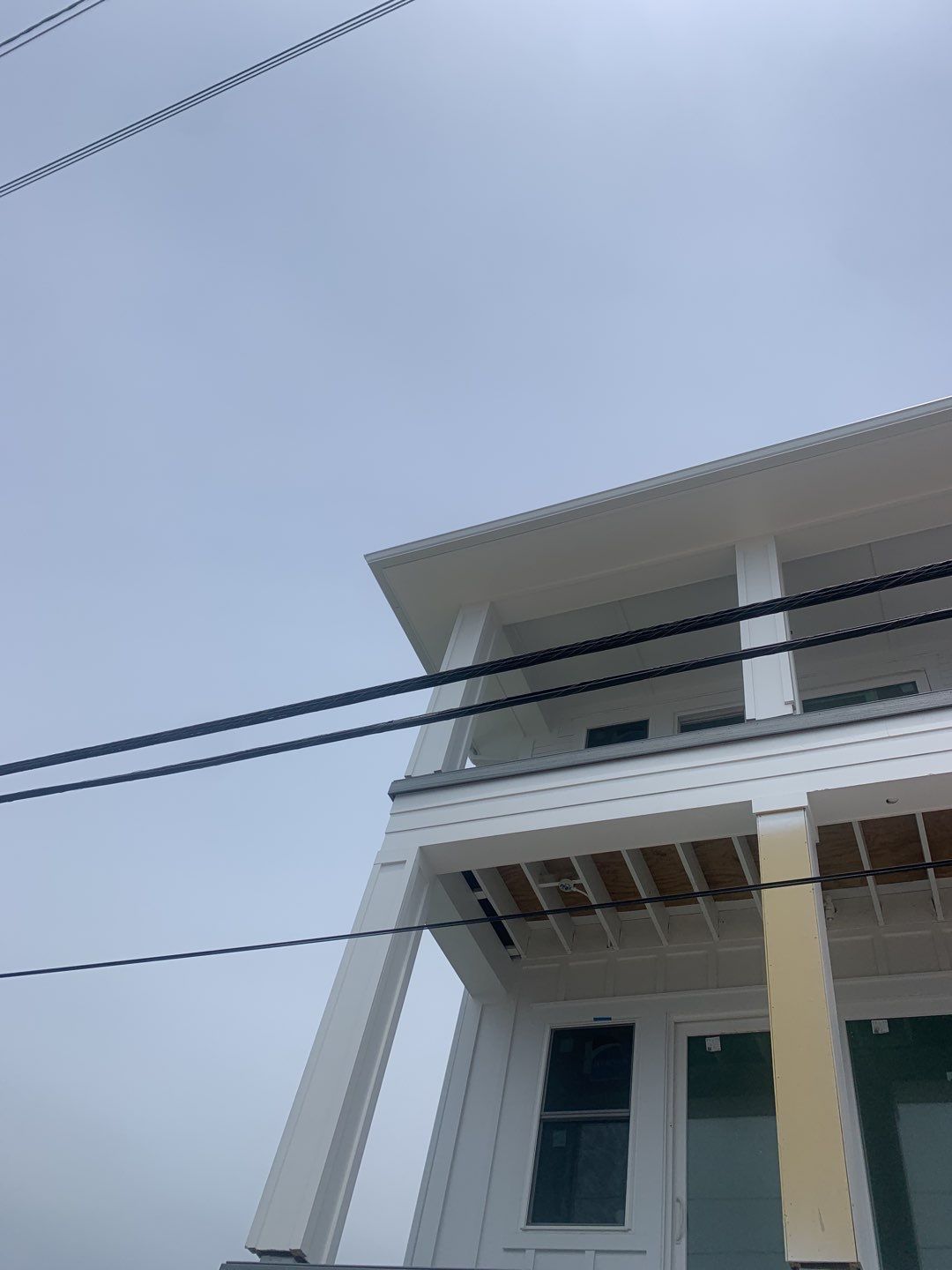 Downspout Installation for Multi-Story Building in Panama City FL by Gutter Professors