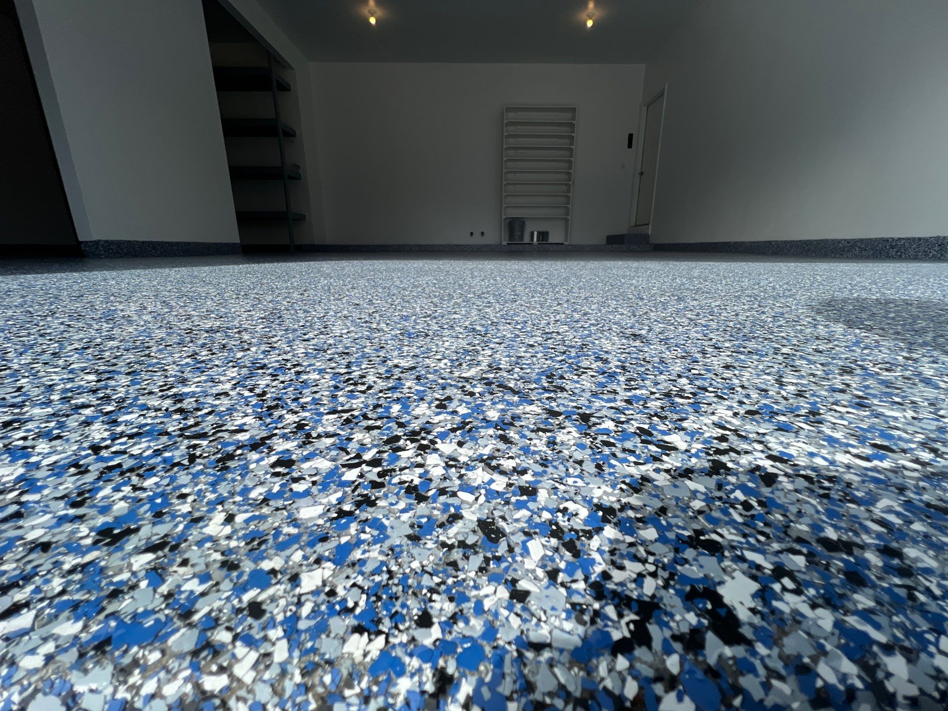 Custom Epoxy Flake Floor and Garage Wall Renovation in Ada by Gordon Painting