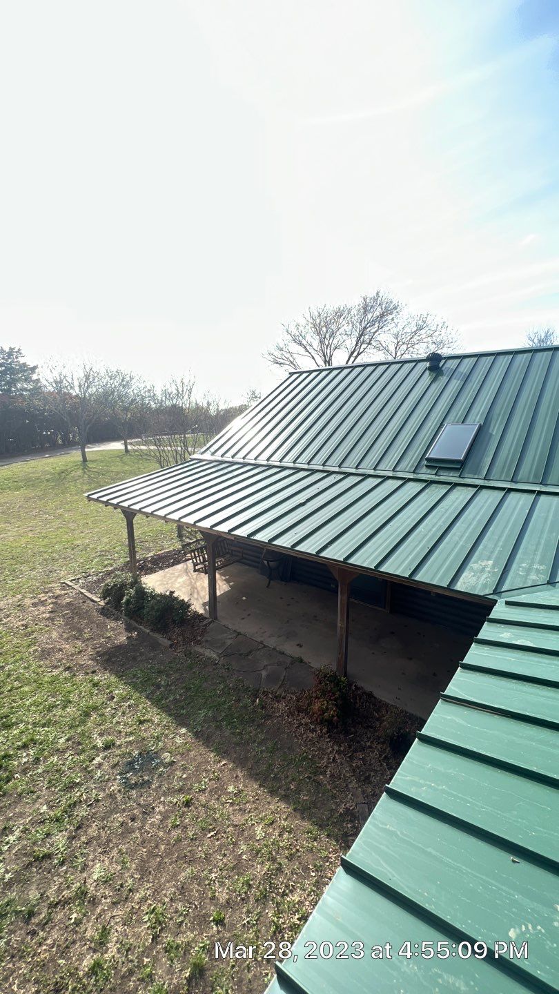 Shingle to Standing Seam Metal Roof by Springtree Restoration