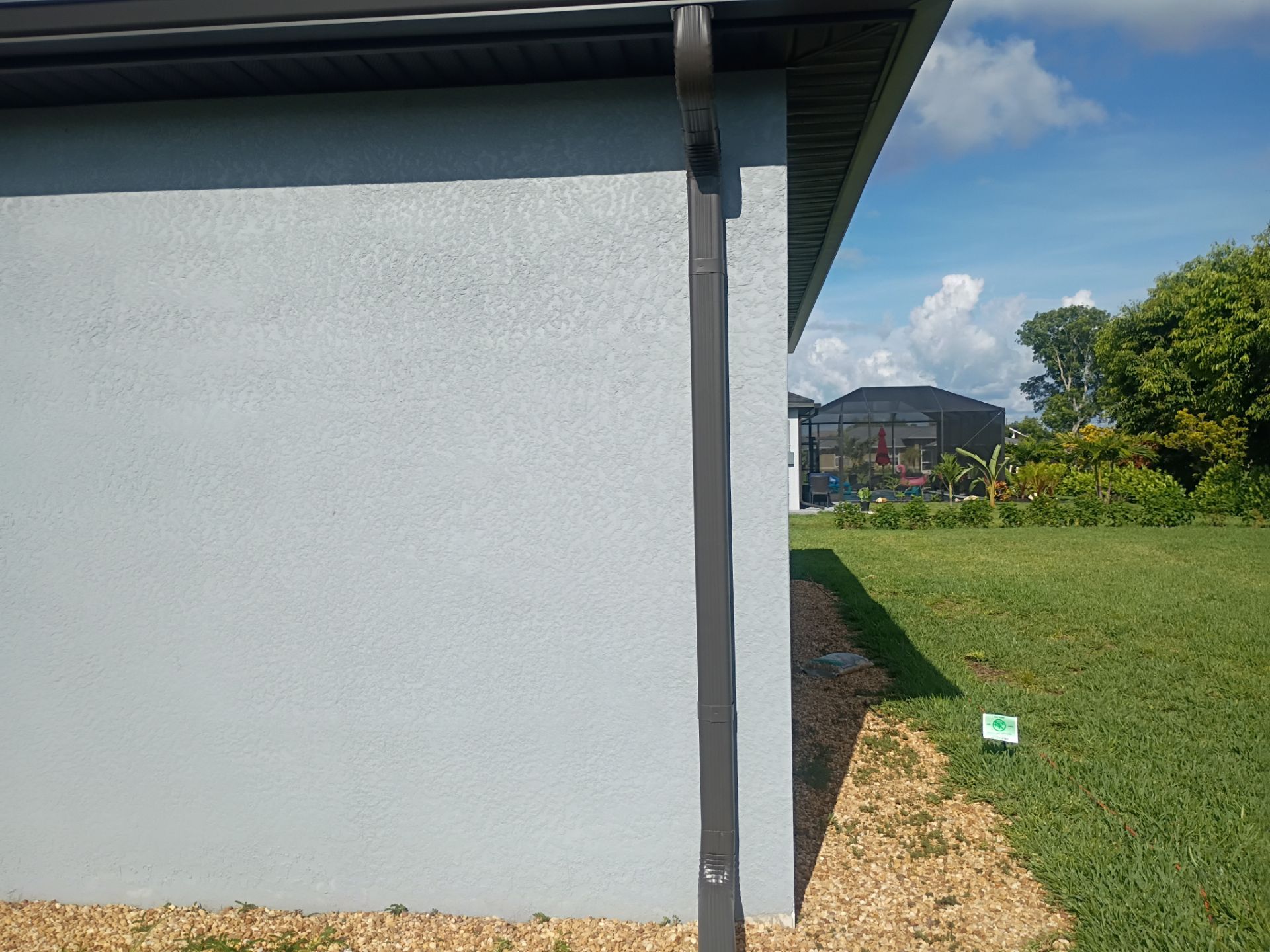 Dark Bronze Seamless Gutters using 6 Inch Seamless Gutters in Cape Coral FL by Gutter Professors