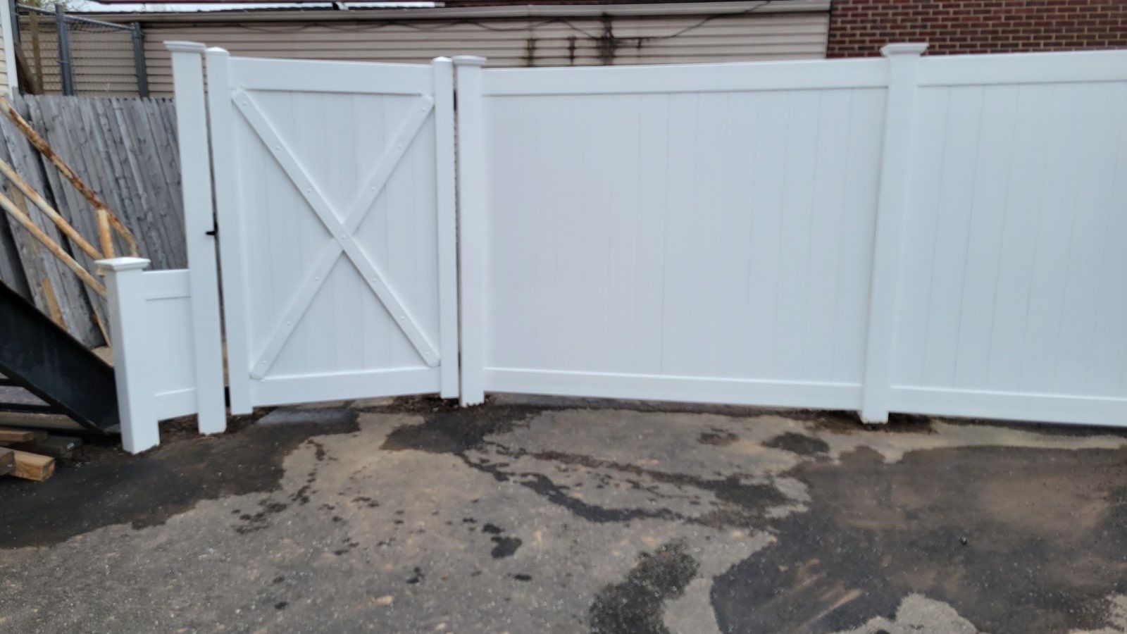 Vinyl Privacy Fence, With matching gate in White  by DiGiorgi Roofing and Siding Inc