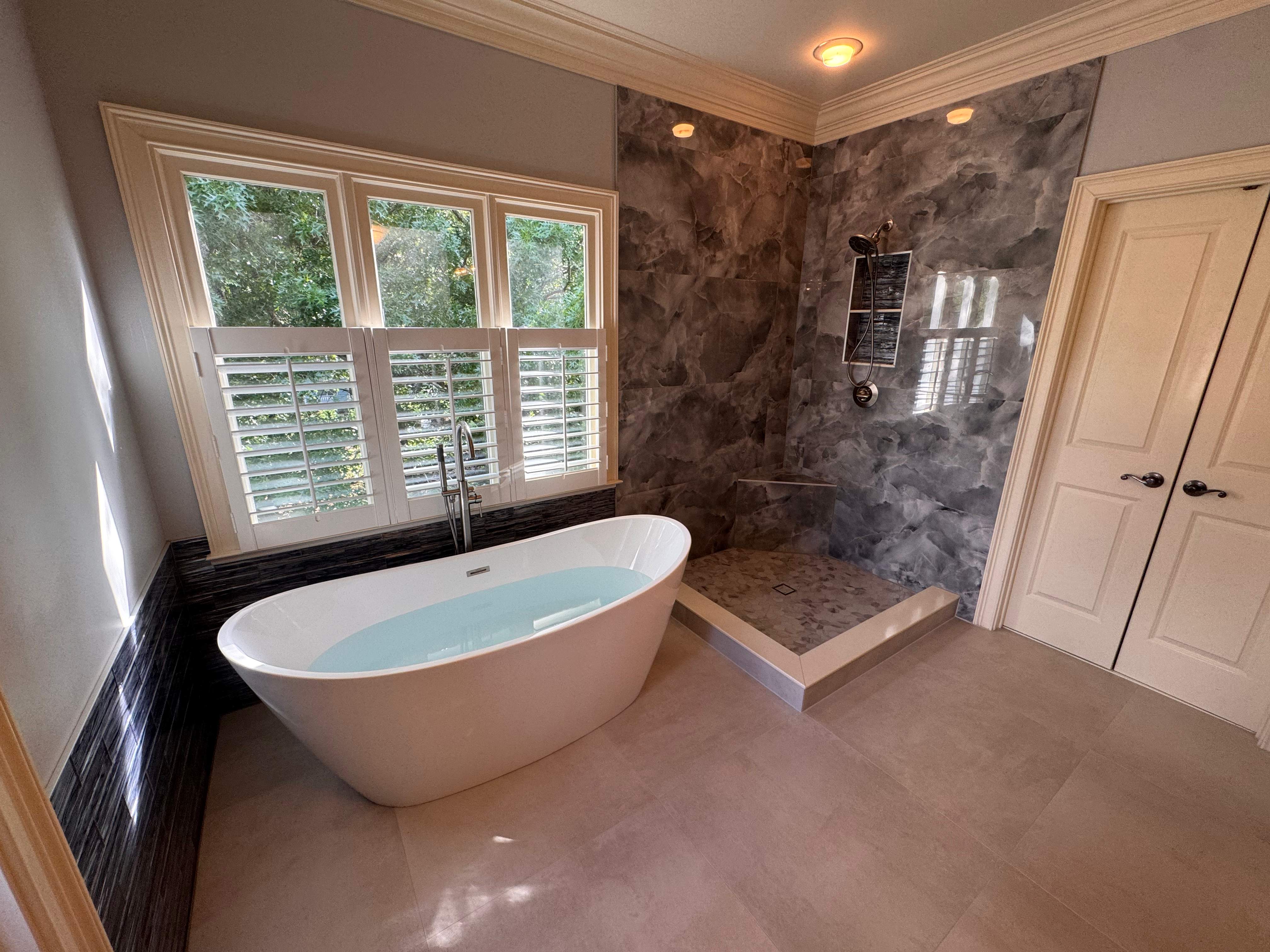 Master bathroom renovation using Free standing tub by Prudencio