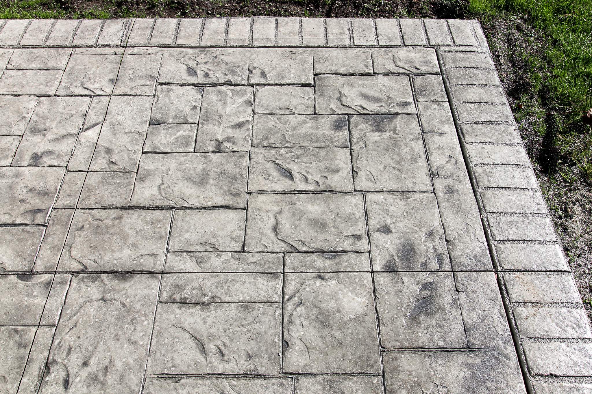 Stamped Concrete and Entry Door by Ivy Lea Construction