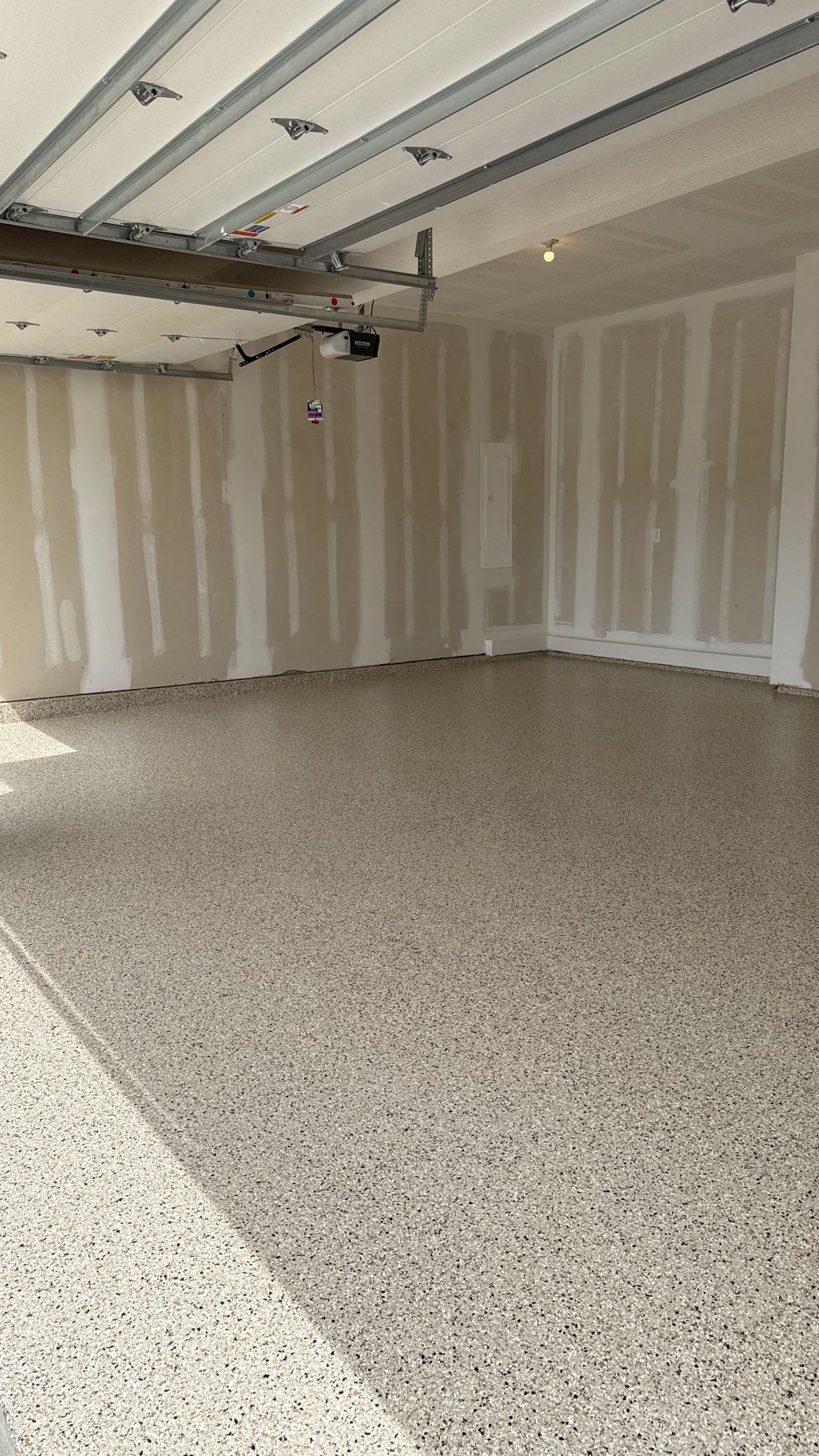 Raymore Garage Finishing With Custom Epoxy Floor Coating by Banner Garage