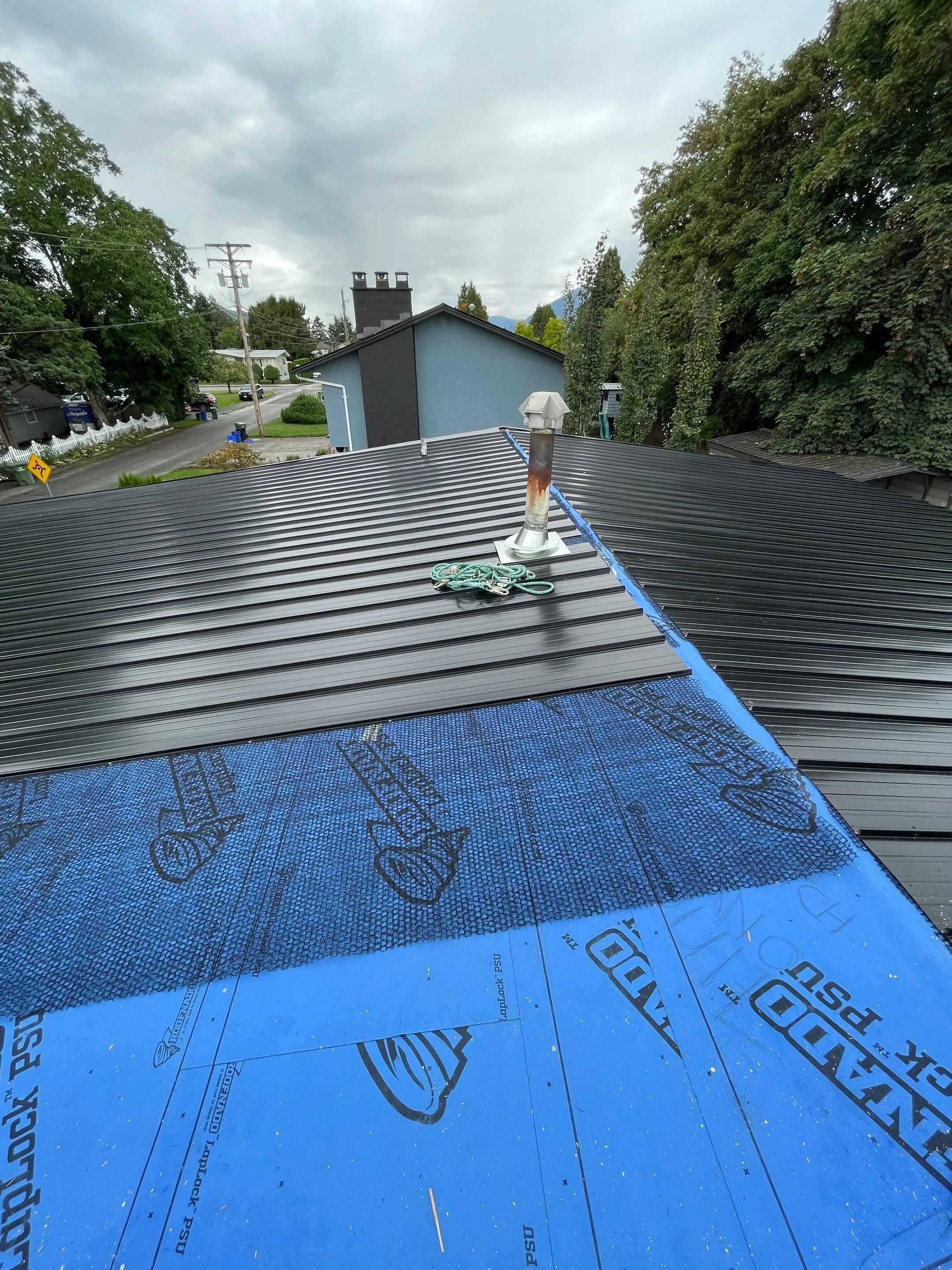 Residential Roofing Installation using 12" Prolok metal  by Top Notch Roofing Inc