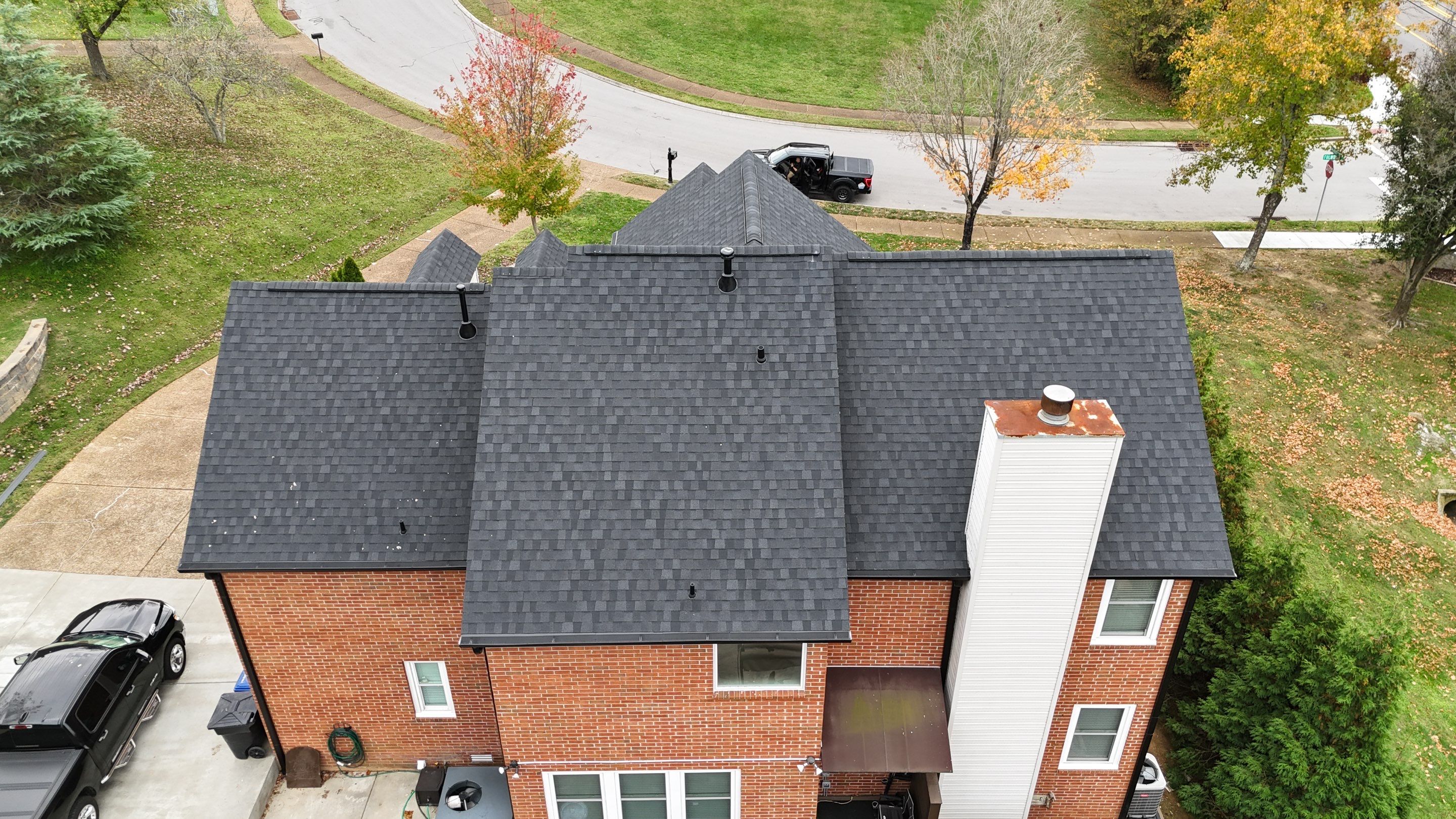 Charcoal Black Re-Roof & Gutters by Royal House LLC
