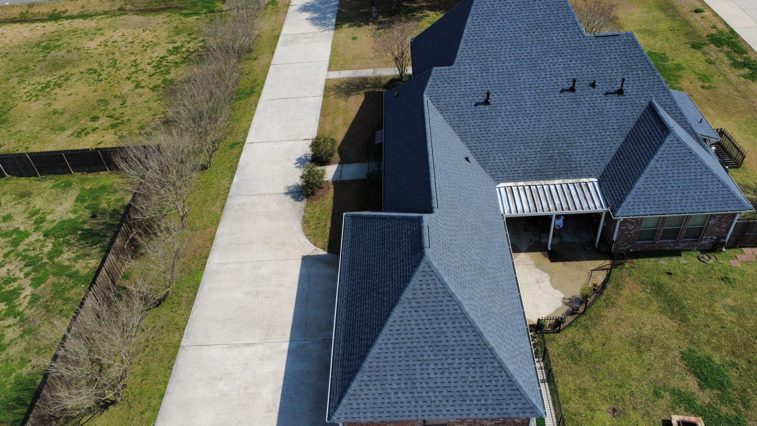 Residential roof installation in Plaquemine, LA using Atlas Pinnacle Pristine Pewter shingles  by Top Team Roofing & Construction