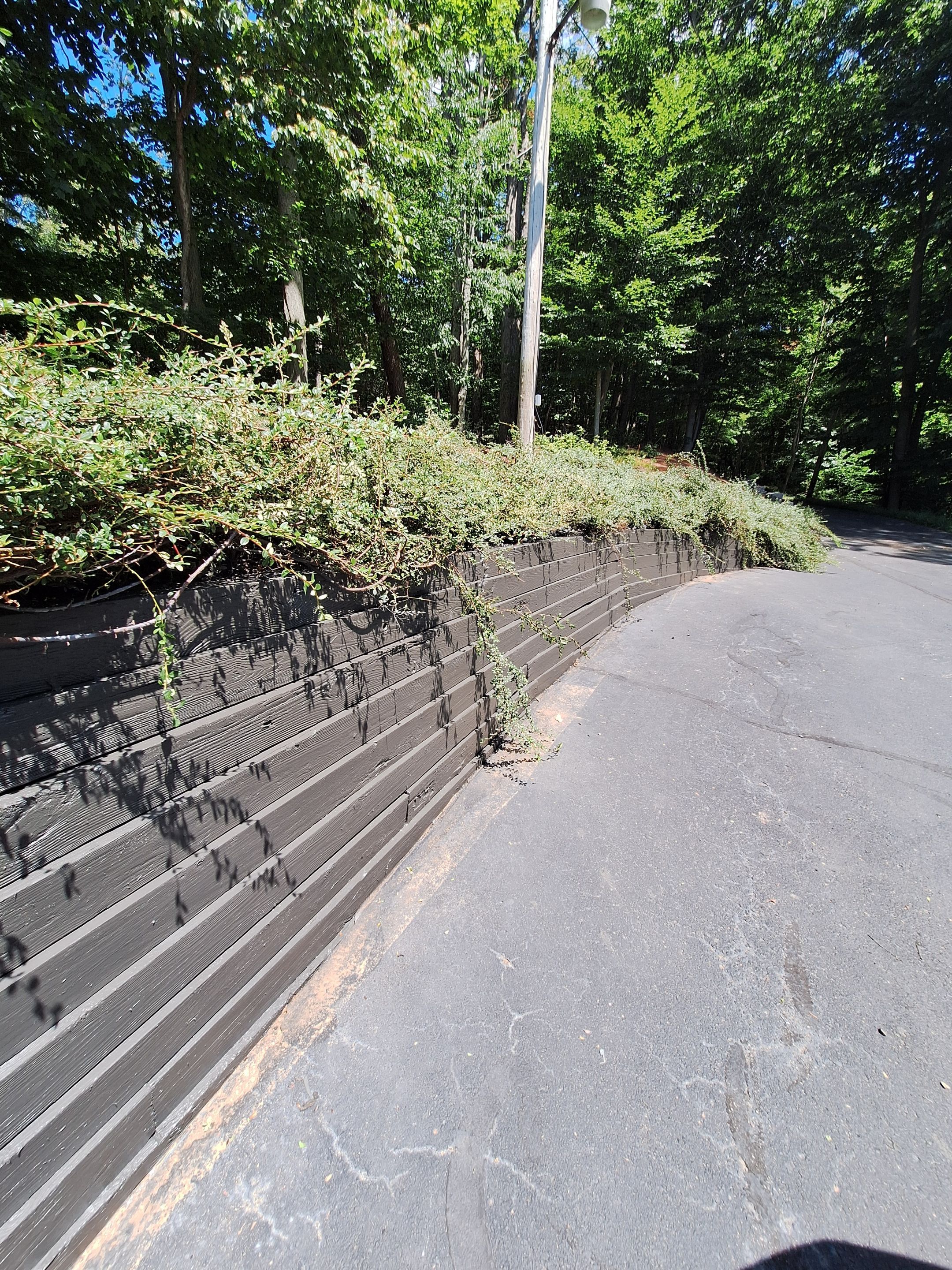 Exterior Retaining Wall Painting | Grand Haven, Michigan by Gordon Painting